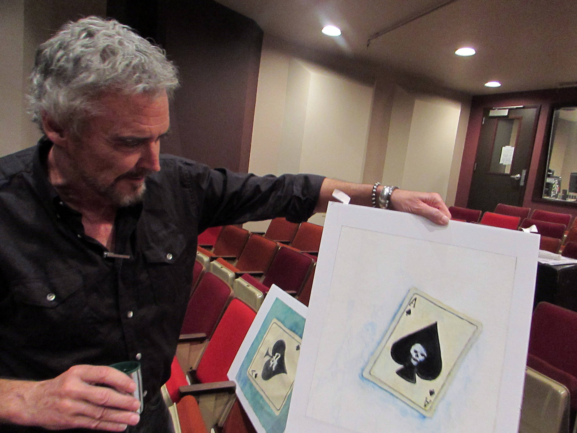 Dave Hunsaker, librettist and stage director for “The Princess Sophia” opera, shows off art by Dan Fruits, which will be projected at a much larger scale during the opera. Ben Hohenstatt | Capital City Weekly)
