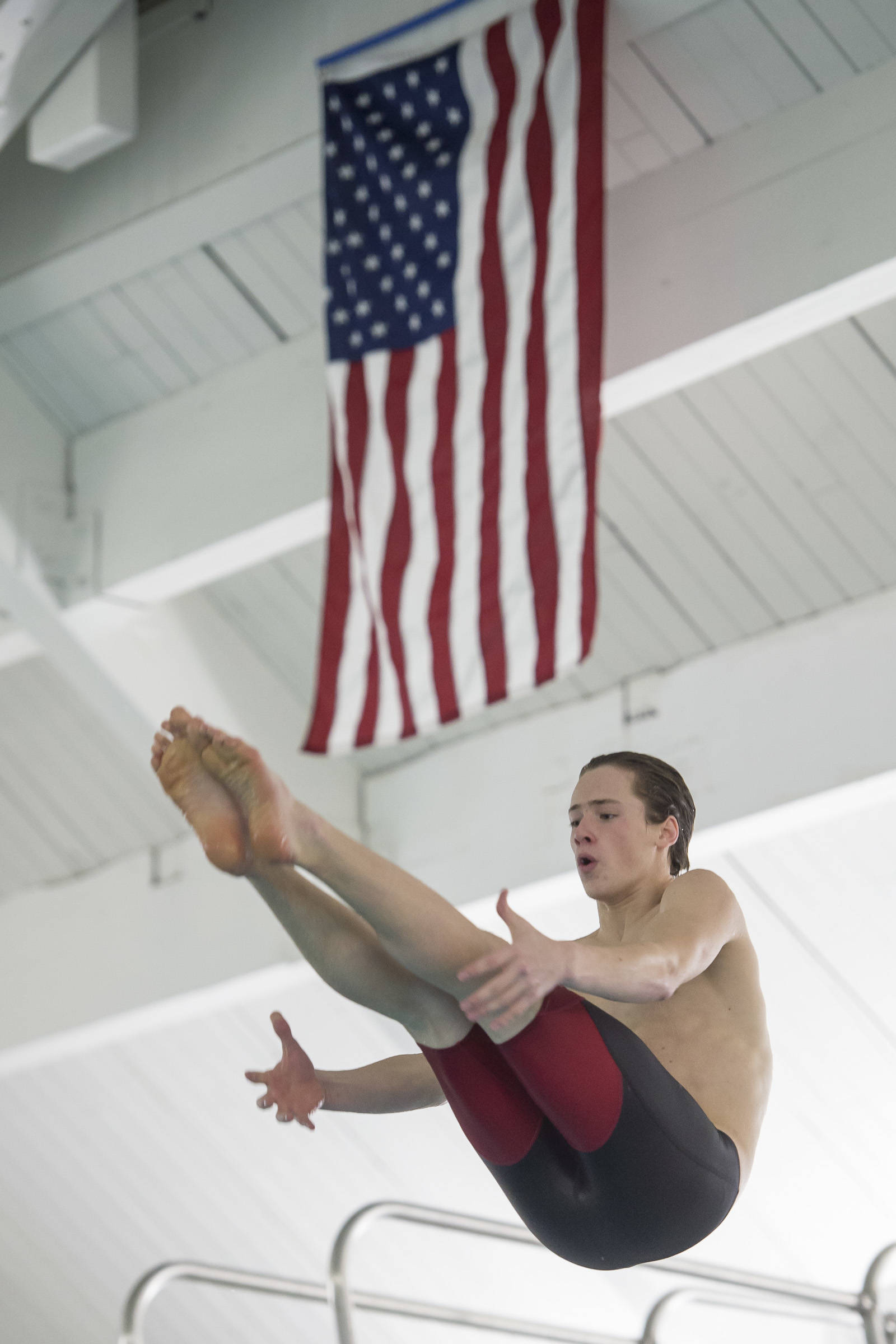 Juneau-Douglas High School senior Cian Hart practices his diving at the Augustus Brown Swimming Pool on Wednesday, Oct. 17, 2018. (Michael Penn | Juneau Empire)
