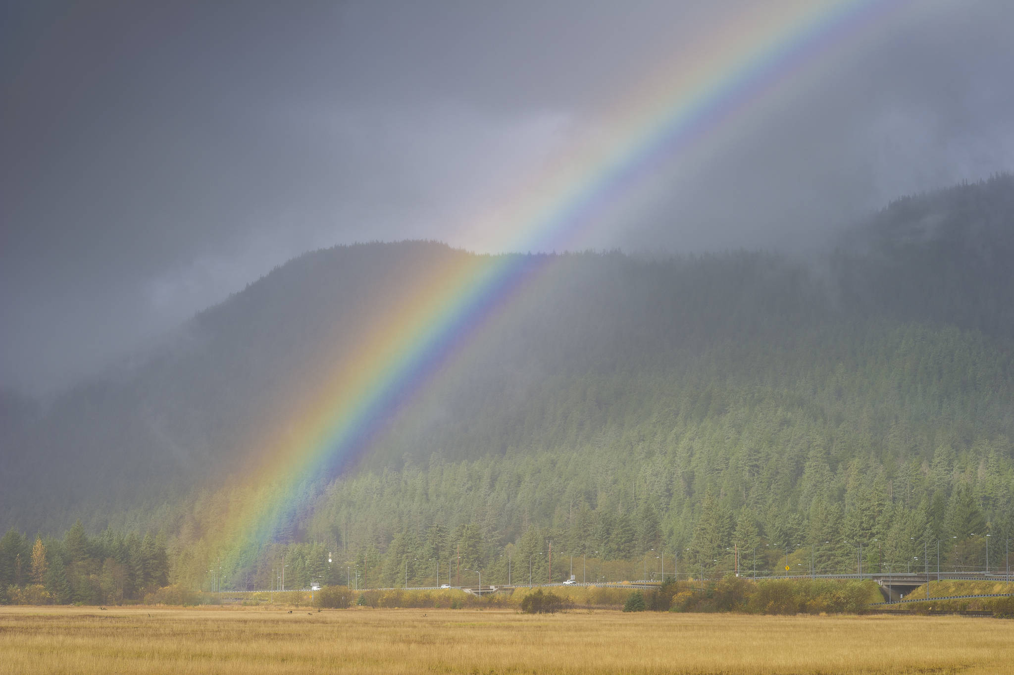 Showers bring a rainbow into view near Sunny Point on Monday, Oct. 15, 2018. (Michael Penn | Juneau Empire)