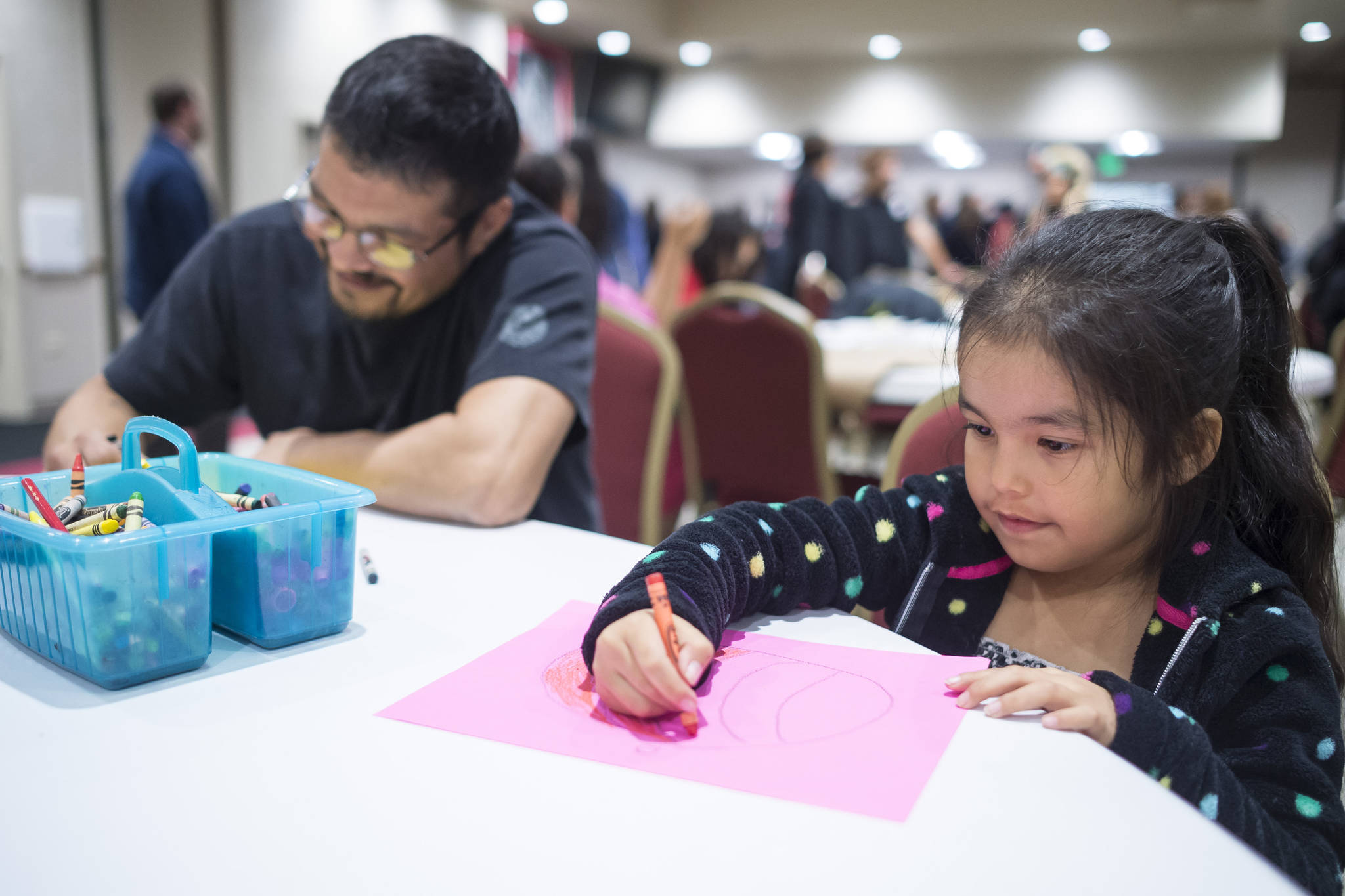 Carl Stepetin draws with his daughter, Pauline, 6, during a Celebrate Survivors gathering sponsored by Central Council Tlingit and Haida Indian Tribes of Alaska and AWARE in the Elizabeth Peratrovich Hall on Tuesday, Oct. 23, 2018. October is Domestic Violence Awareness Month. (Michael Penn | Juneau Empire)
