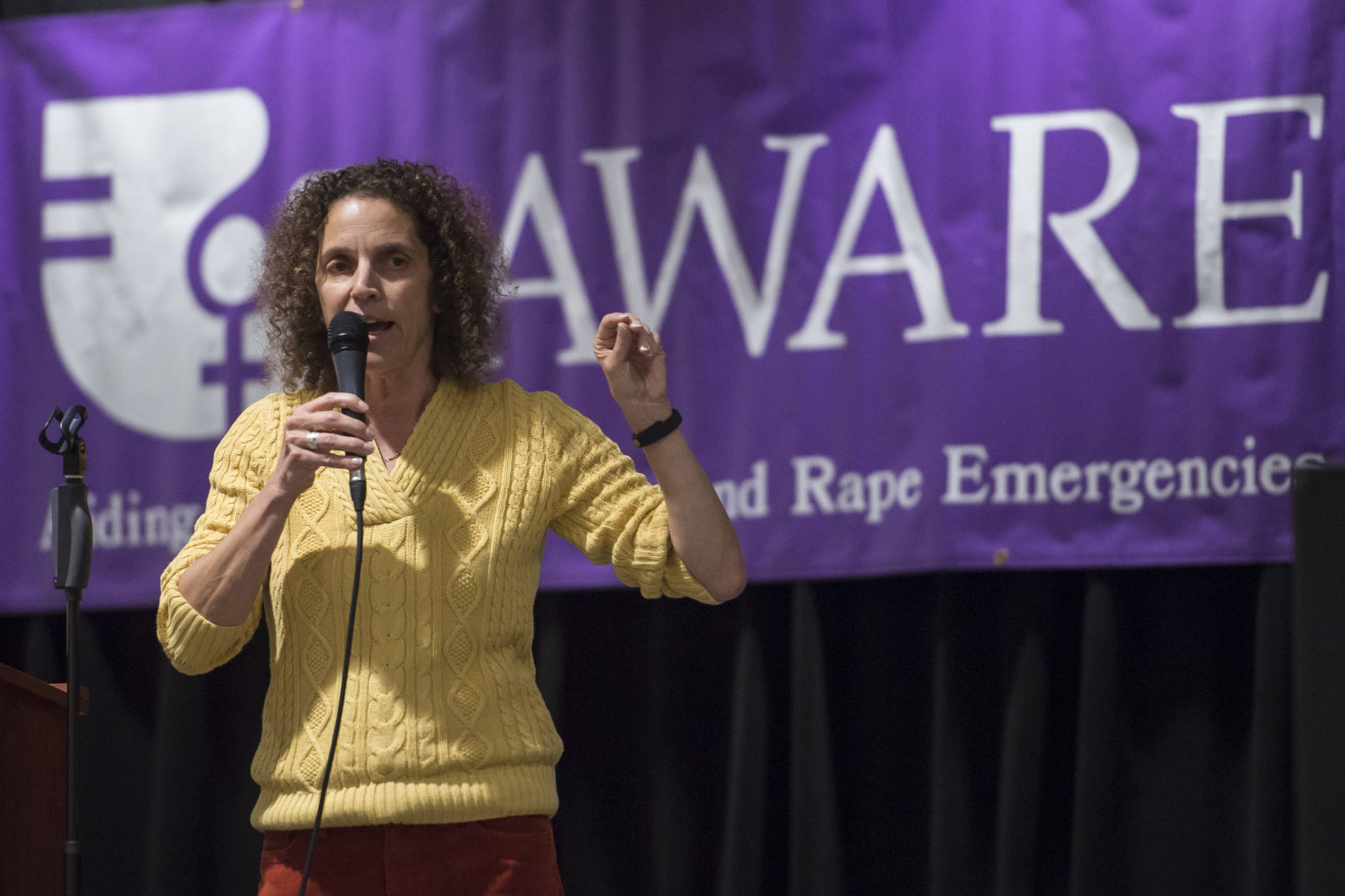 AWARE Executive Director Saralyn Tabachnick welcomes people attending a Celebrate Survivors gathering in the Elizabeth Peratrovich Hall on Tuesday, Oct. 23, 2018. The event is sponsored by Central Council Tlingit and Haida Indian Tribes of Alaska and AWARE. October is Domestic Violence Awareness Month. (Michael Penn | Juneau Empire)