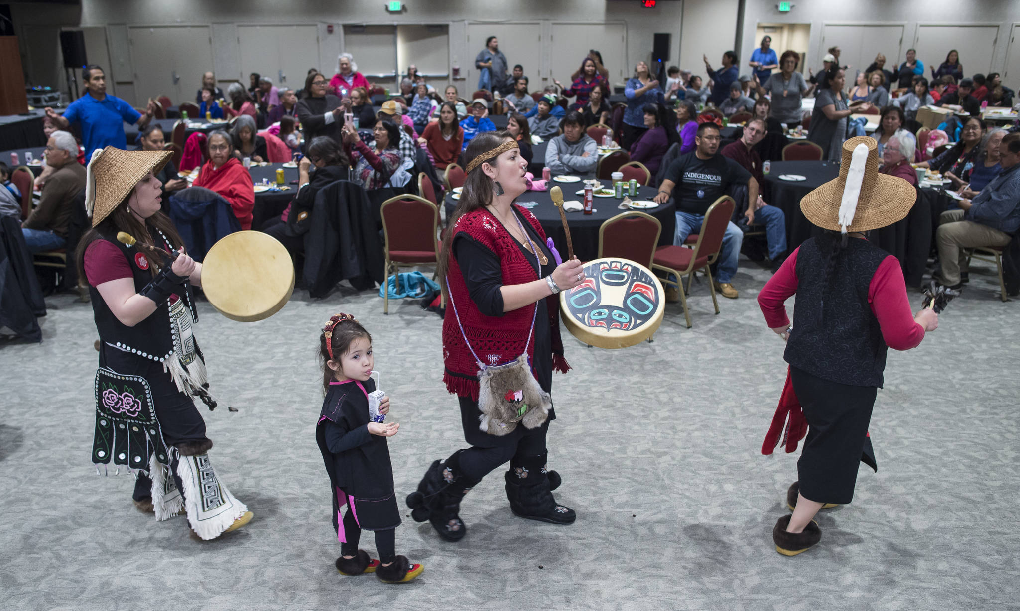 Members of the Woosh.ji.een Dance Group perform during a Celebrate Survivors gathering sponsored by Central Council Tlingit and Haida Indian Tribes of Alaska and AWARE in the Elizabeth Peratrovich Hall on Tuesday, Oct. 23, 2018. October is Domestic Violence Awareness Month. (Michael Penn | Juneau Empire)