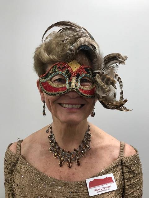 Mary Lou Gerbi, FOSLAM president, smiles in a borrowed mask from Venice during the Mask-erade Ball held to raise money for Friends of the State Library, Archives and Museum. An auction of custom-made masks and a mask-making workshop raised $914 for the organization. (Courtesy photo | Mary Lou Gerbi for FOSLAM)