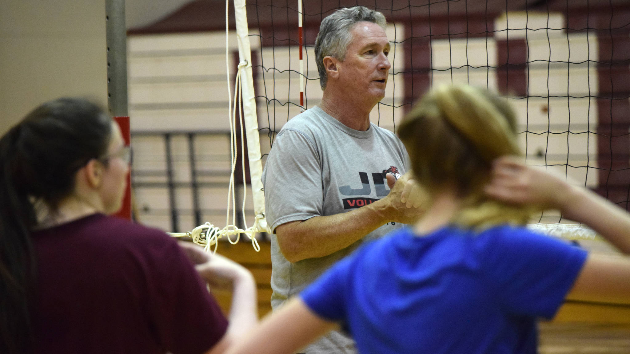 Juneau-Douglas High School assistant volleyball coach Dale Bontrager speaks at practice last season. Bontrager retired from coaching volleyball at the beginning of the season. (Nolin Ainsworth | Juneau Empire File)