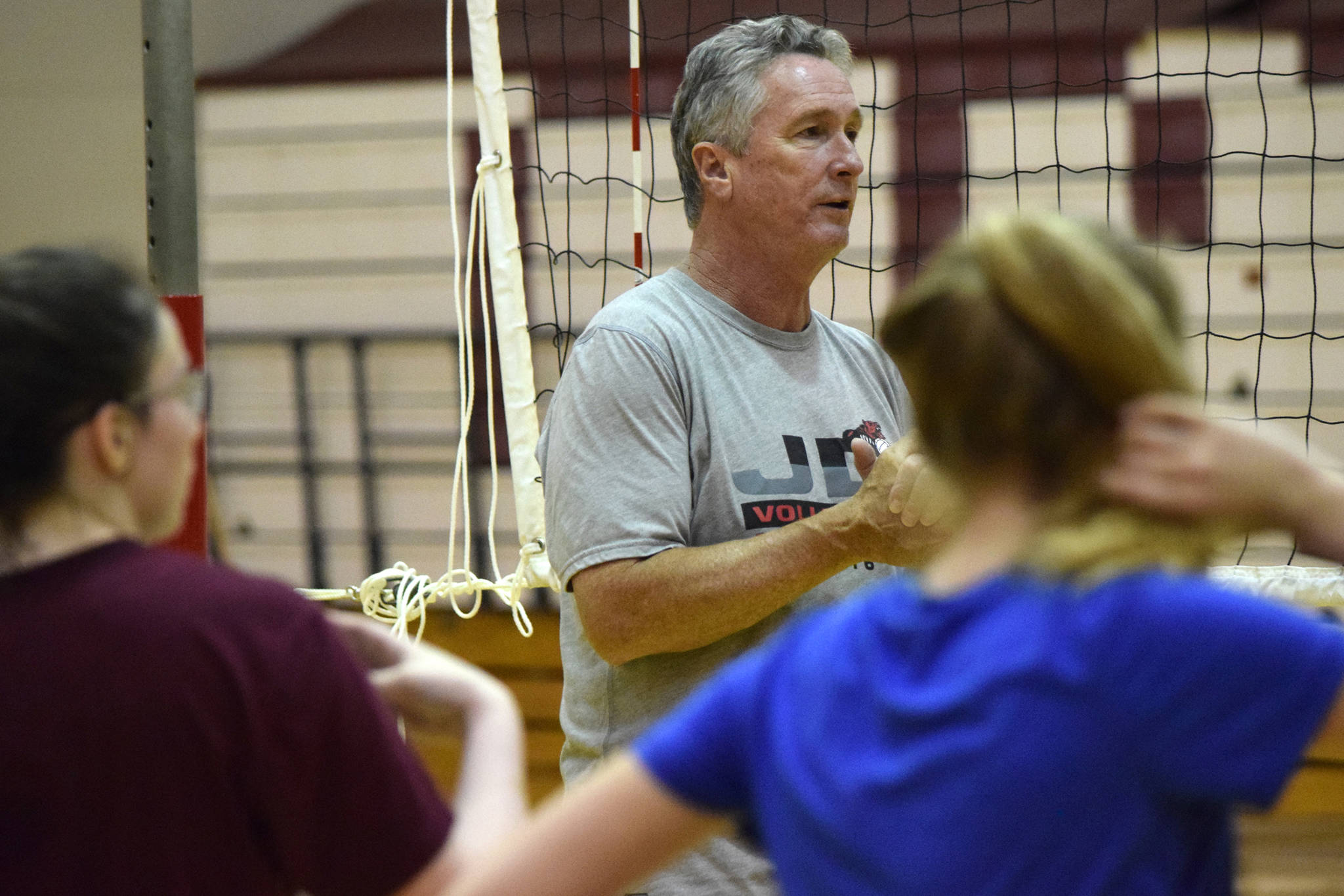 Juneau-Douglas High School assistant volleyball coach Dale Bontrager speaks at practice last season. Bontrager retired from coaching volleyball at the beginning of the season. (Nolin Ainsworth | Juneau Empire File)