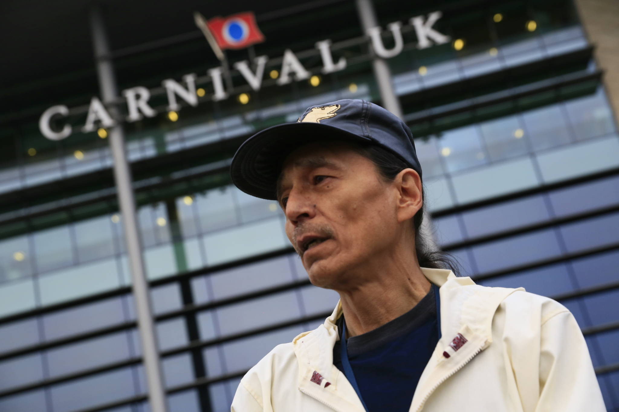 Delbert Pungowiyi, Alaska, President of Native Village of Savoonga (on St. Lawrence Island near the Bering Strait) stands in front of the UK HQ of cruise industry giant Carnival Corporation. (Courtesy Photo | Jiri Rezac via Stand.earth)