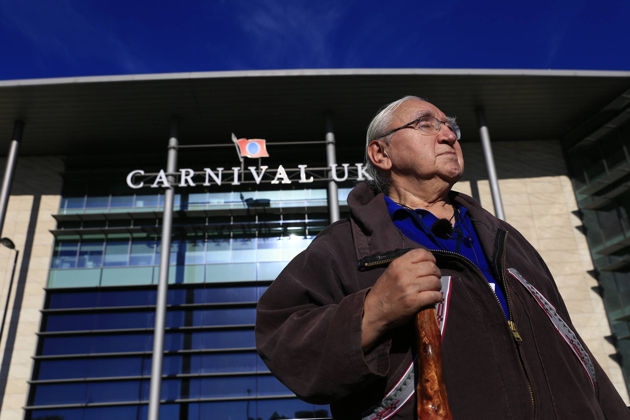 George Edwardson, board member for Inuit Circumpolar Council-Alaska and President of the Inupiat Community of the Arctic Slope (ICAS) stands in front of the UK HQ of cruise industry giant Carnival Corporation. (Courtesy Photo | Jiri Rezac via Stand.earth)