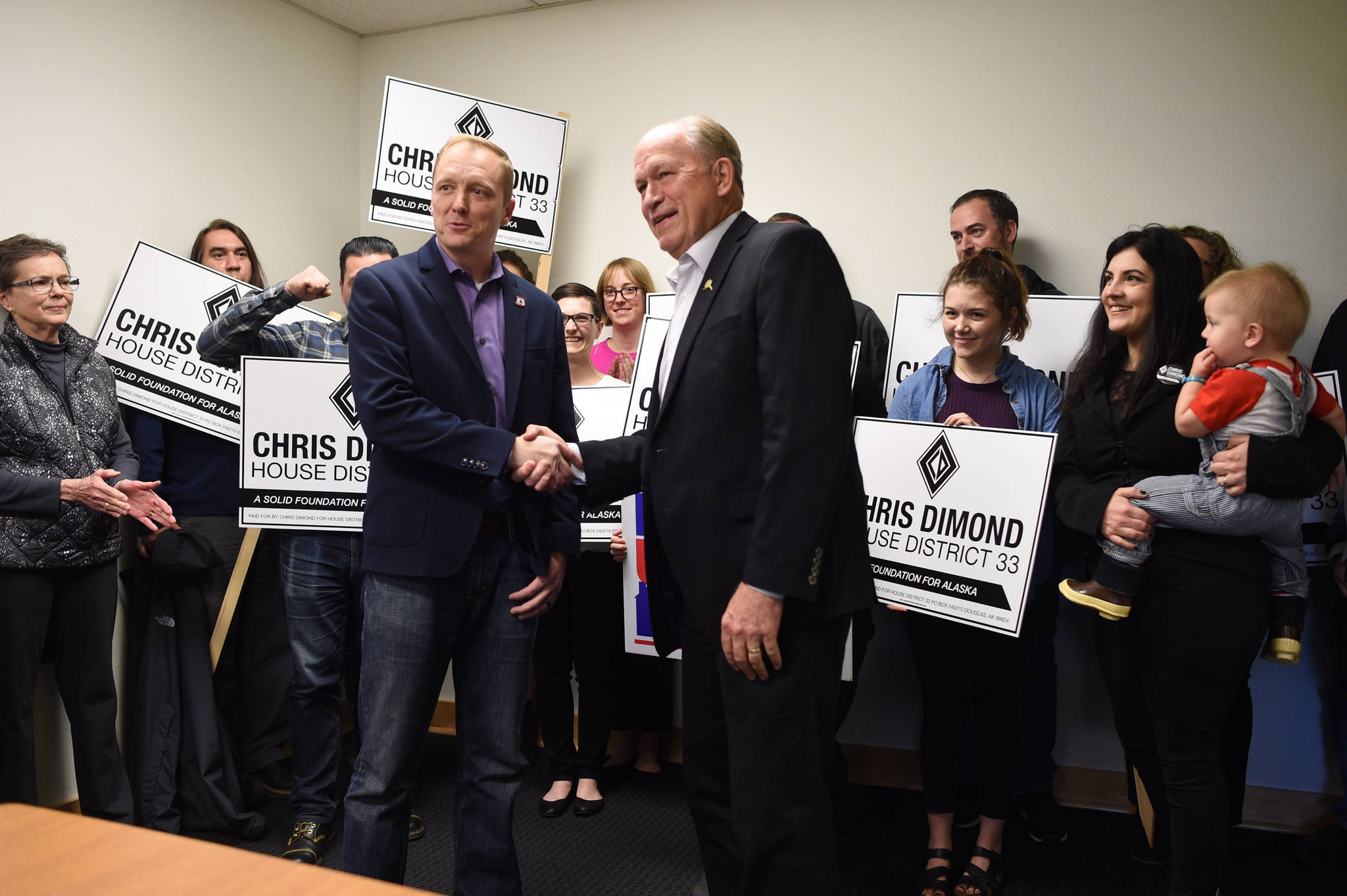 Gov. Bill Walker meets with House District 33 independent candidate Chris Dimond and his supporters at the IBEW union hall to give his endorsement to Dimond on Tuesday, Oct. 30, 2018. (Michael Penn | Juneau Empire)