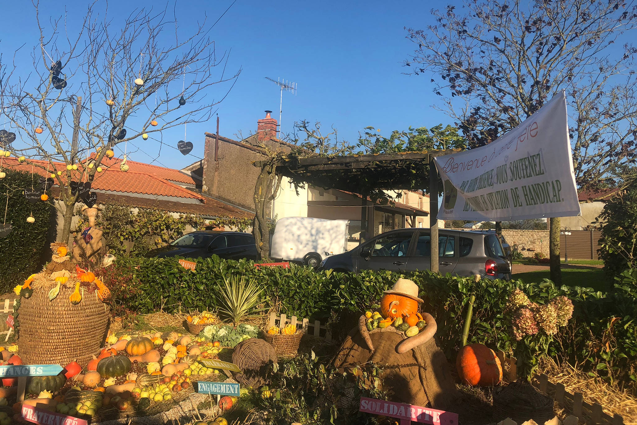 The entrance to the festival decorated with colorful gourds, one wearing a hat on Oct. 21, 2018. (Bridget McTague | For the Juneau Empire)