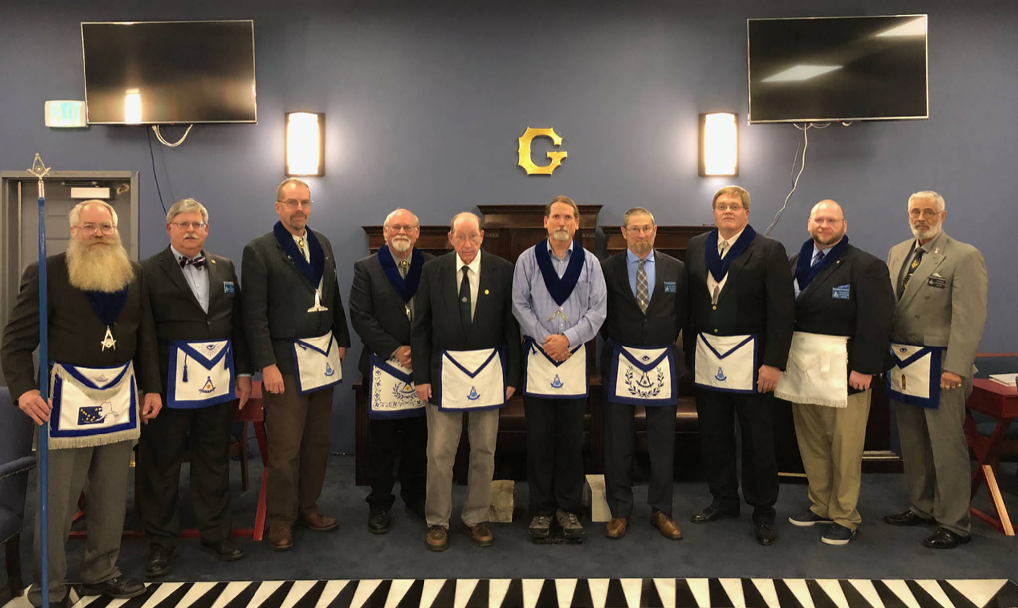Pictured from left: Ray Rusaw, Allen Bell, Jeff DeFreest, John Barnett, Harley Clough, Dan McCrummen, Bruce Morley, Russ Shivers, Charles Ward and Merchant Thompson. Rusaw, DeFreest, Barnett, Clough, McCrummen, Morley, Shivers and Ward are Past Masters of Mt. Juneau-Gastineaux Lodge or one of its predecessor lodges - Mt. Juneau and Gastineaux.