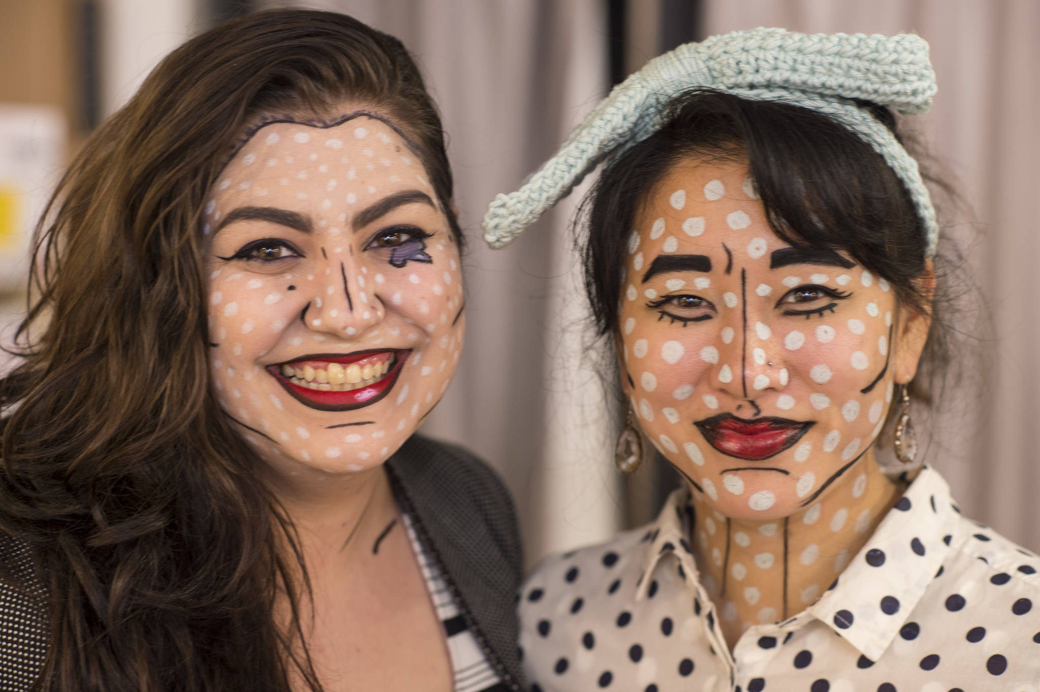 Kindred Post’s Kristen Cornell, left, and Rebecca Hsieh pose for a portrait on Wednesday, Oct. 31, 2018. For the fourth year Kindred Post has organized the Halloween celebration for trick-or-treaters. (Michael Penn | Juneau Empire)