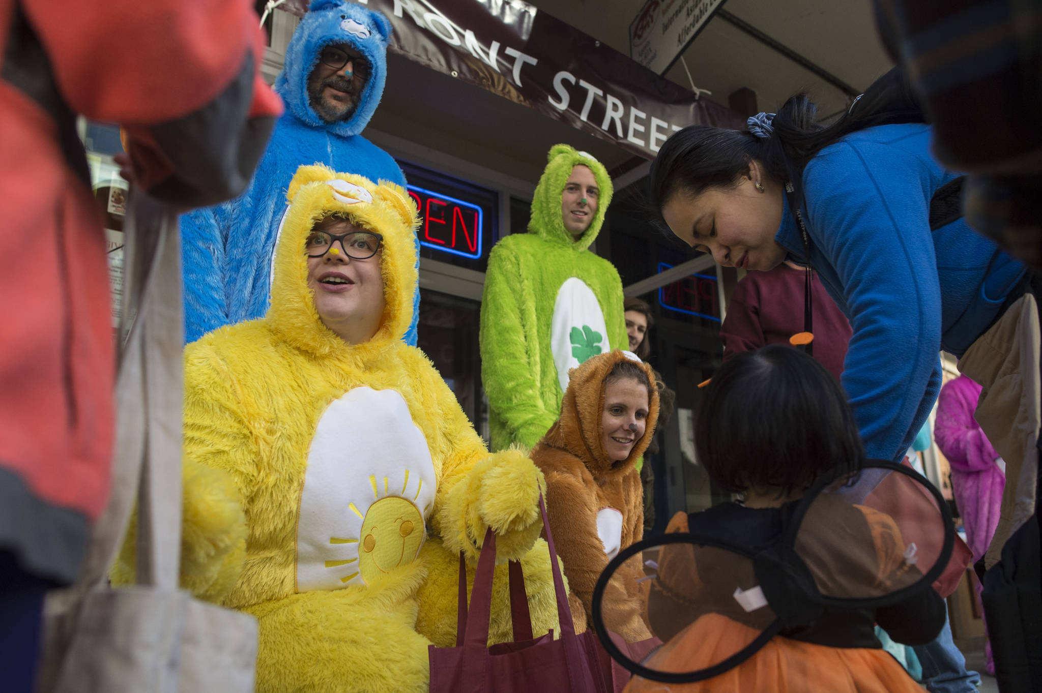 Staff of Front Street Clinic make a colorful group as they hand out candy and school supplies for Halloween on Wednesday, Oct. 31, 2018. For the fourth year Kindred Post has organized the Halloween celebration for trick-or-treaters. (Michael Penn | Juneau Empire)