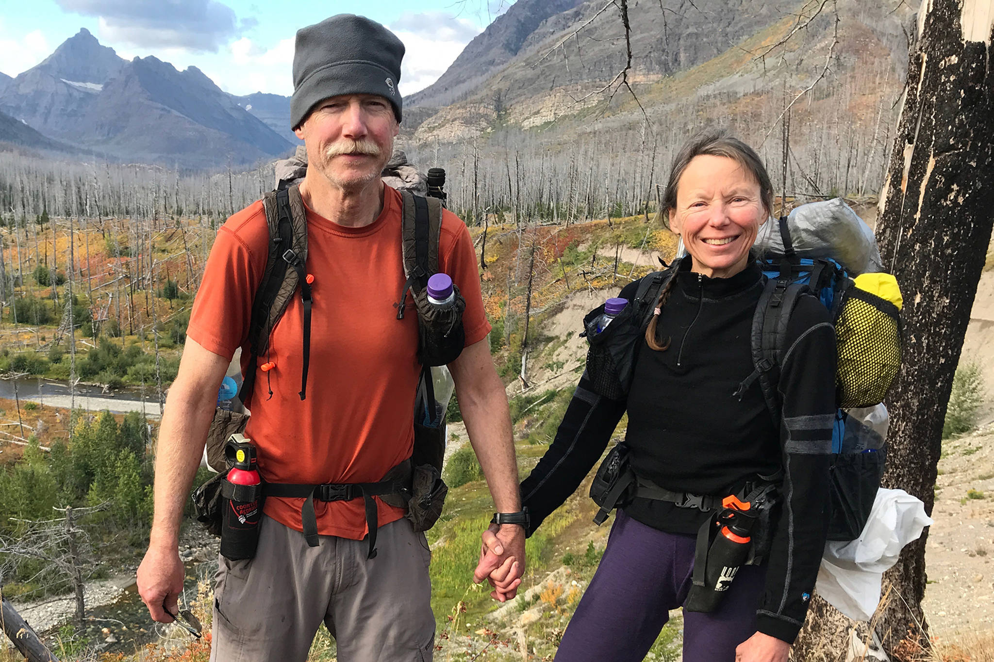 Jeff Sauer and his wife, Theresa Svancara, stop for a picture in Glacier National Park in Montana while hiking the Continental Divide Trail in September 2018. (Photo courtesy Jeff Sauer)