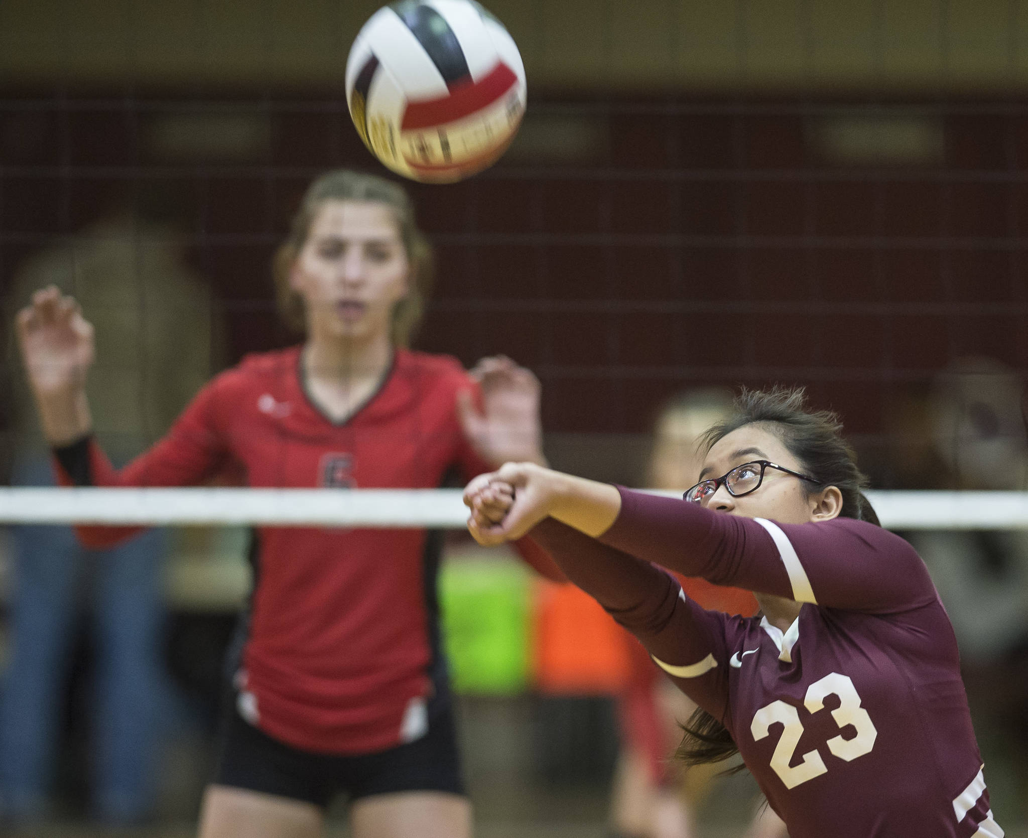 Ketchikan’s Karen Abigania bumps the ball up against Juneau-Douglas High School in the first round of the Region V Volleyball Championships at JDHS on Friday, Nov. 2, 2018. JDHS won 3-0 (25-13, 25-16, 25-16). (Michael Penn | Juneau Empire)