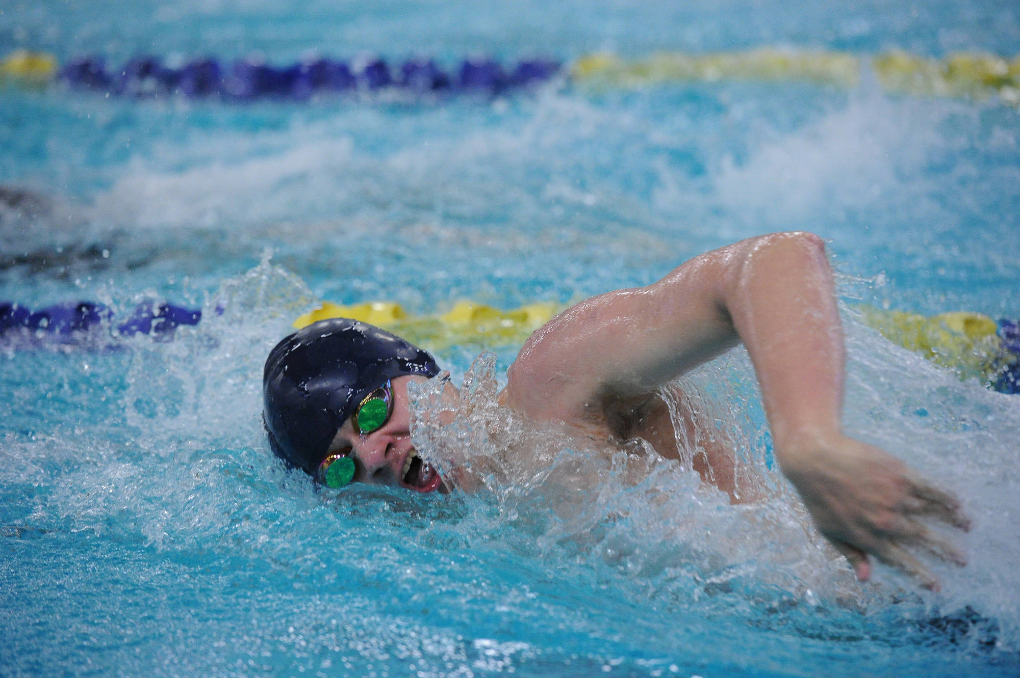 Thunder Mountain High School junior Micah Grigg swms in the 200-yard freestyle final on Saturday at the ASAA/First National Bank Alaska Swim & Dive Championships at Bartlett Pool in Anchorage. Grigg finished in fifth place. (Michael Dinneen | For the Juneau Empire)