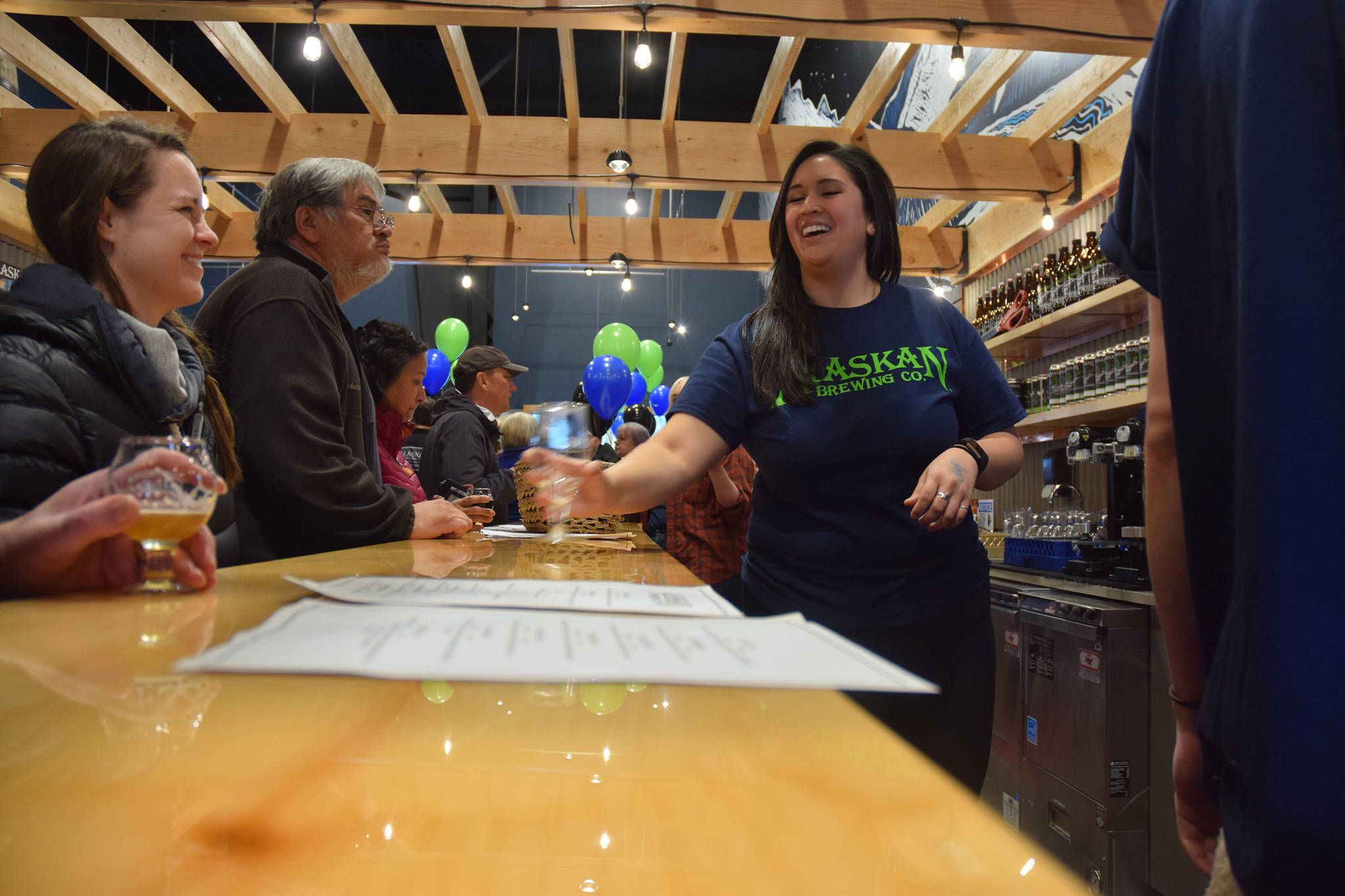 Alaskan Brewery Co.’s new tasting room, pictured here at its Saturday, Nov. 3 grand opening, boasts 20 taps. (Kevin Gullufsen | Juneau Empire)