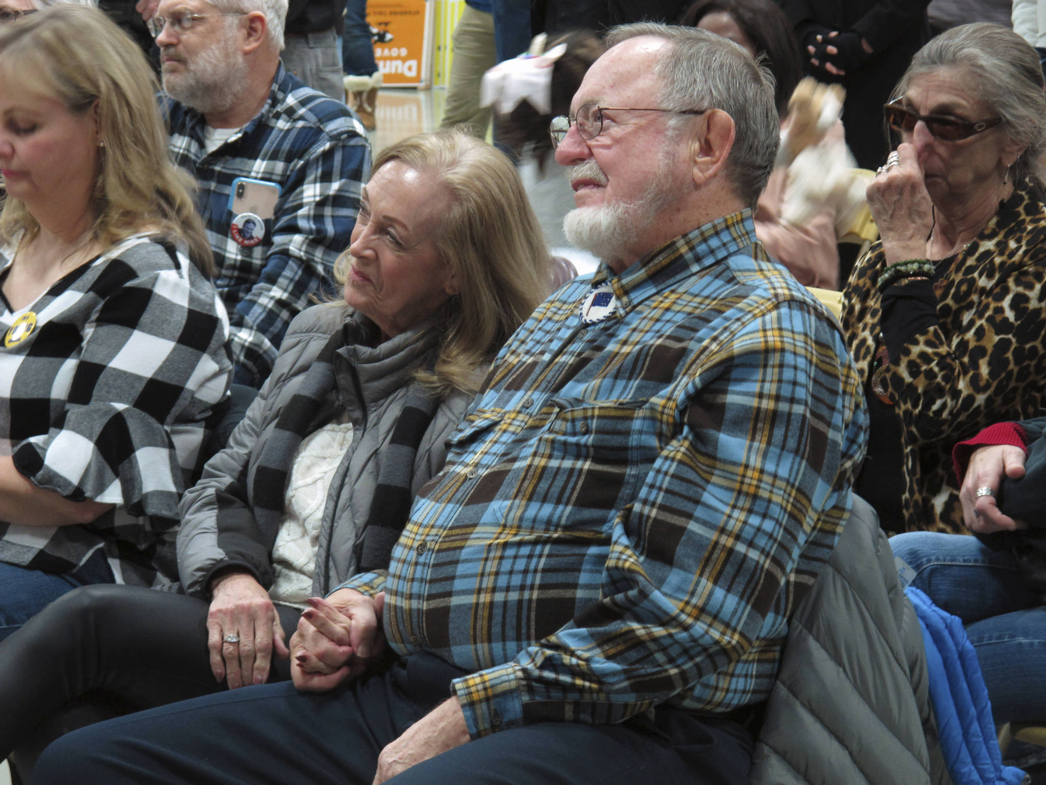 Alaska U.S. Rep. Don Young holds hands with his wife, Anne Garland Walton, during a GOP rally in Anchorage, Alaska, Sunday, Nov. 4, 2018. Young, they longest-serving current member of the U.S. House, beat challenger Alyse Galvin on Tuesday. (AP Photo/Becky Bohrer)