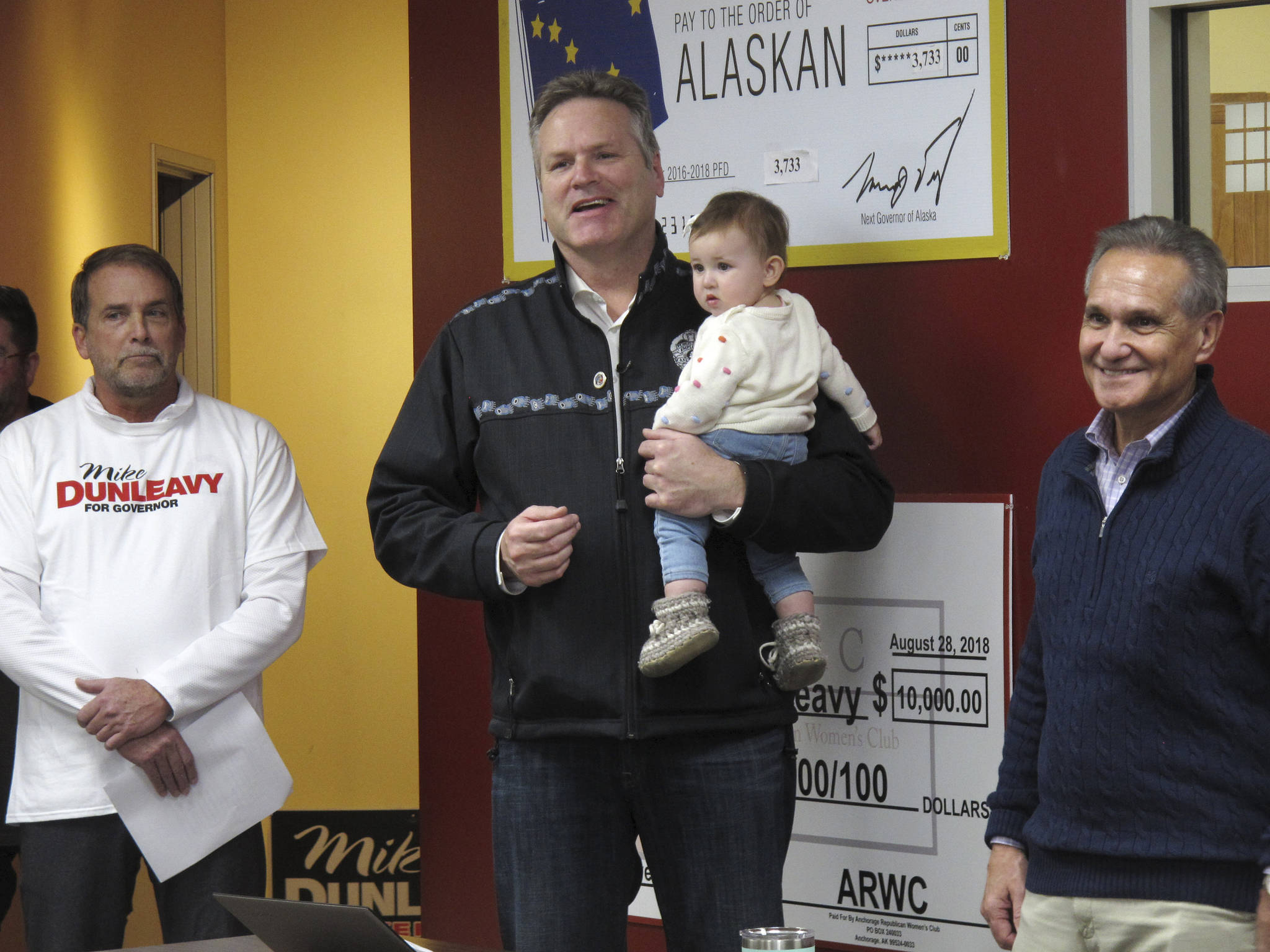 Alaska Gov.-elect Mike Dunleavy, center, speaks to supporters at his campaign headquarters on Monday. Dunleavy announced a handful of appointments Thursday, including Brett Huber, at left, as senior policy adviser. (Becky Bohrer | The Associated Press File)