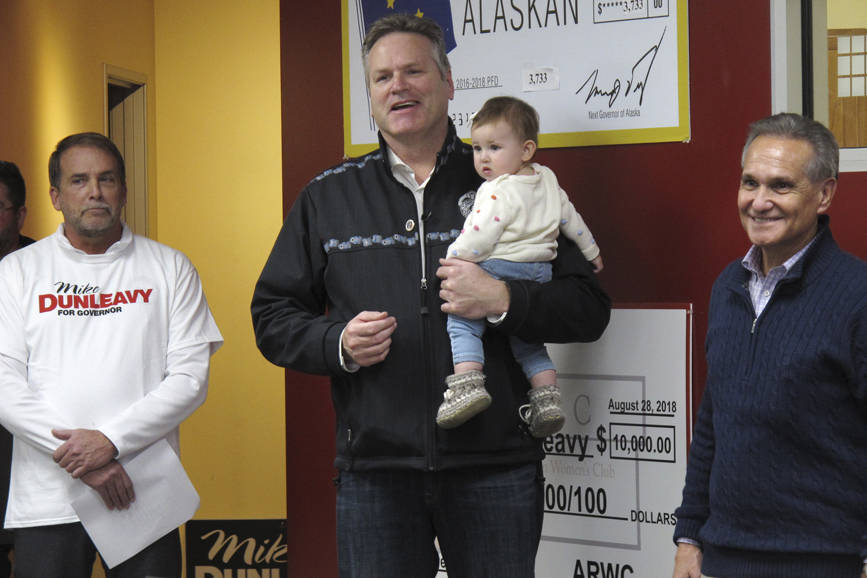 Alaska Gov.-elect Mike Dunleavy, center, speaks to supporters at his campaign headquarters on Monday. Dunleavy announced a handful of appointments Thursday, including Brett Huber, at left, as senior policy adviser. (Becky Bohrer | The Associated Press File)