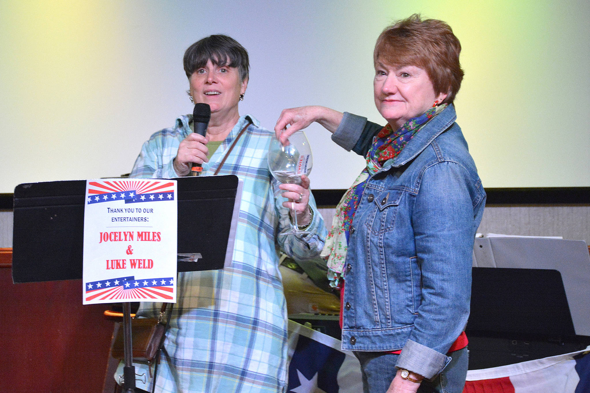 League of Women Voters of Juneau Director Judith Mitchell and Vice President Marianne Mills draw a door prize during the League’s fourth annual Wine Tasting and Silent Auction Fundraiser on Oct. 5, 2018, at the Hangar Ballroom. (Courtesy Photo | Kim Andree Jones)