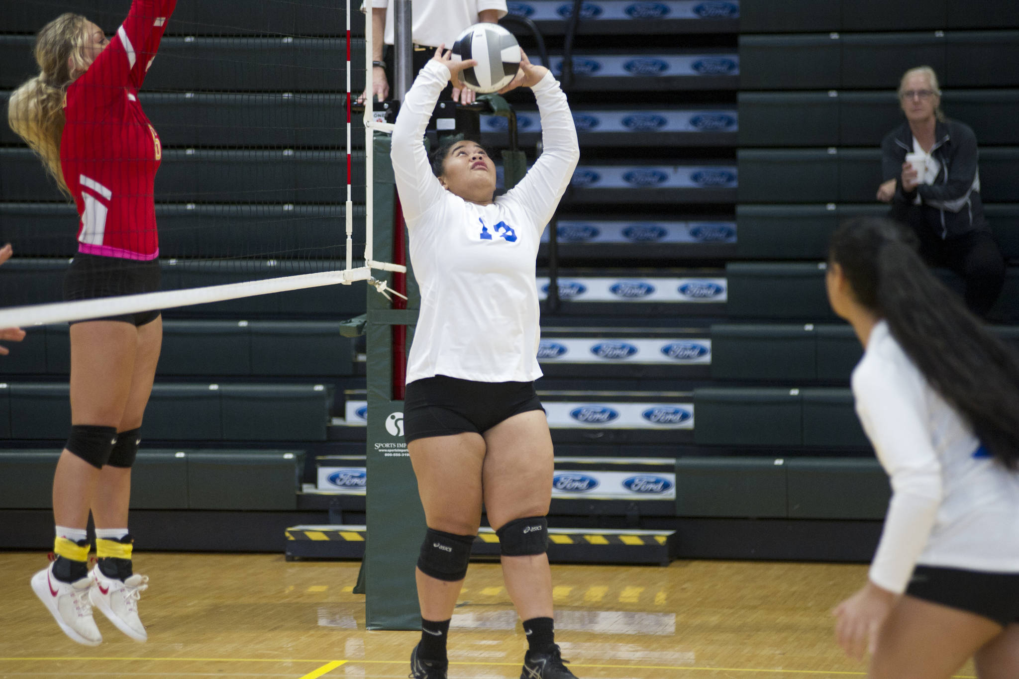 Thunder Mountain High School senior Marissa Tanuvasa-Tuaifale sets the ball against West Valley at the ASAA/First National Bank Alaska 3A/4A Volleyball State Championships on Friday at the Alaska Airlines Center in Anchorage. The Falcons won 3-1 (26-24, 19-25, 25-18, 25-23). (Nolin Ainsworth | Juneau Empire)