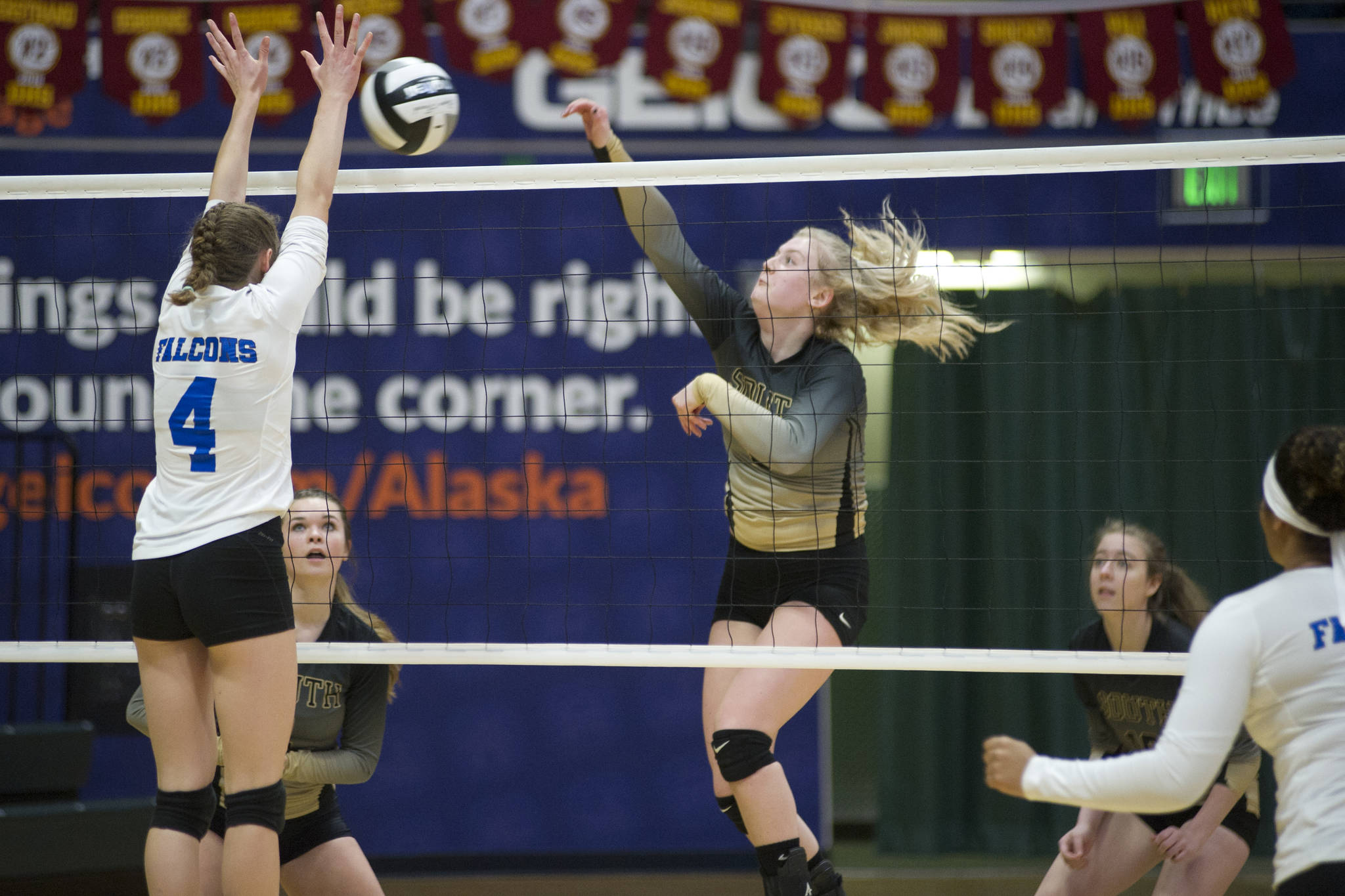 South Anchorage High School senior Erin Doner spikes the ball toward Thunder Mountain’s Sophia Harvey in the ASAA/First National Bank Alaska 3A/4A Volleyball State Championships on Friday at the Alaska Airlines Center in Anchorage. South won 3-0 (25-10, 25-21, 25-12). (Nolin Ainsworth | Juneau Empire)