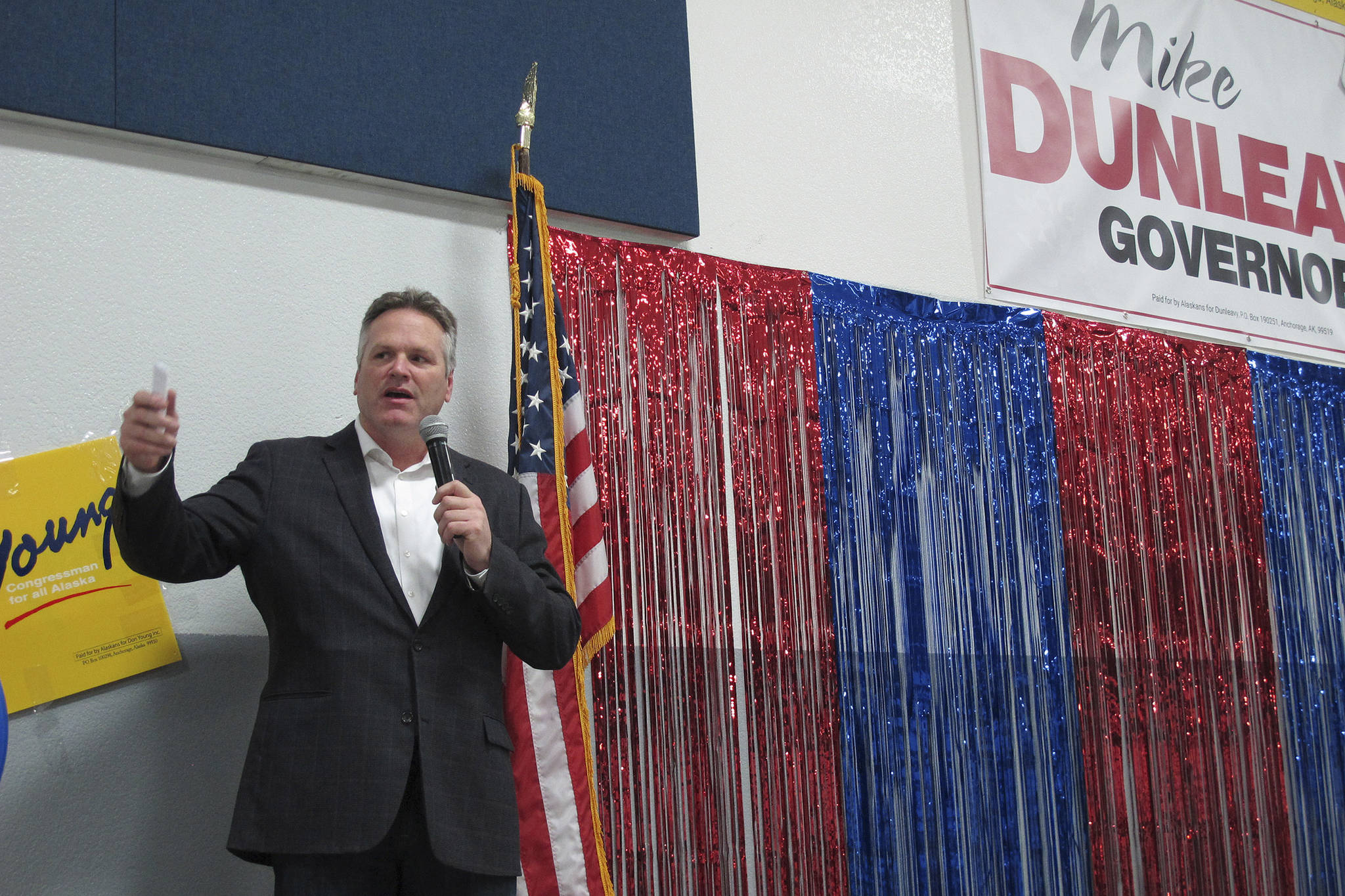In this photo taken Sunday, Nov. 4, 2018, Alaska Republican gubernatorial candidate Mike Dunleavy gestures while on stage during a GOP rally in Anchorage, Alaska. Dunleavy and Democrat Mark Begich are the two major candidates vying to replace Gov. Bill Walker, who ended his campaign in October. (AP Photo/Becky Bohrer)