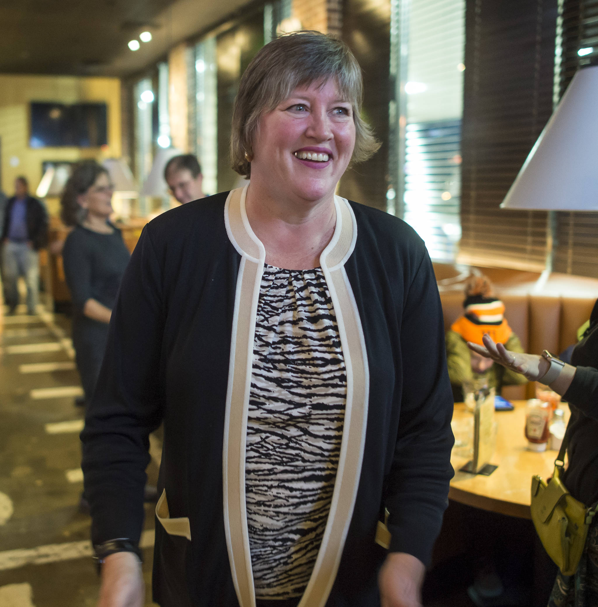 Sara Hannan, Democratic candidate for House Distric 33, walks into McGiveny’s Sports Bar and Grill on election night. Hannan won her race over independent candidate Chris Dimond. (Michael Penn | Juneau Empire)