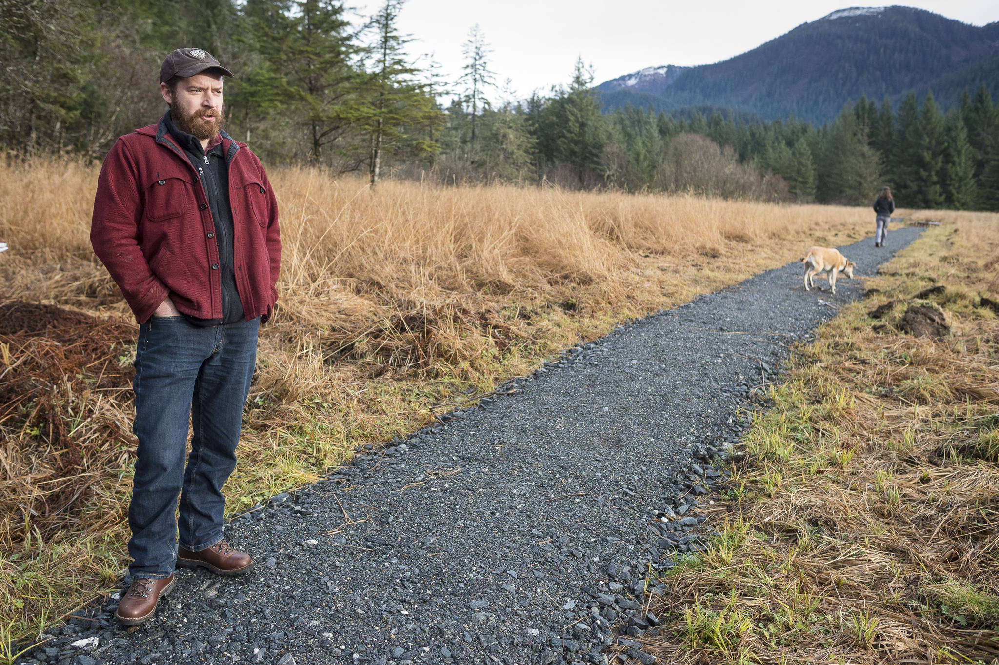 Erik Boraas, Executive Director of Trail Mix, Inc., talks about the organization while walking along the newly reworked Switzer-Marriot Aquatic Education Trail in Switzer Creek on Monday, Nov. 12, 2018. Trail Mix’s annual fundraising dinner and auction is November 17 at Centennial Hall. (Michael Penn | Juneau Empire)