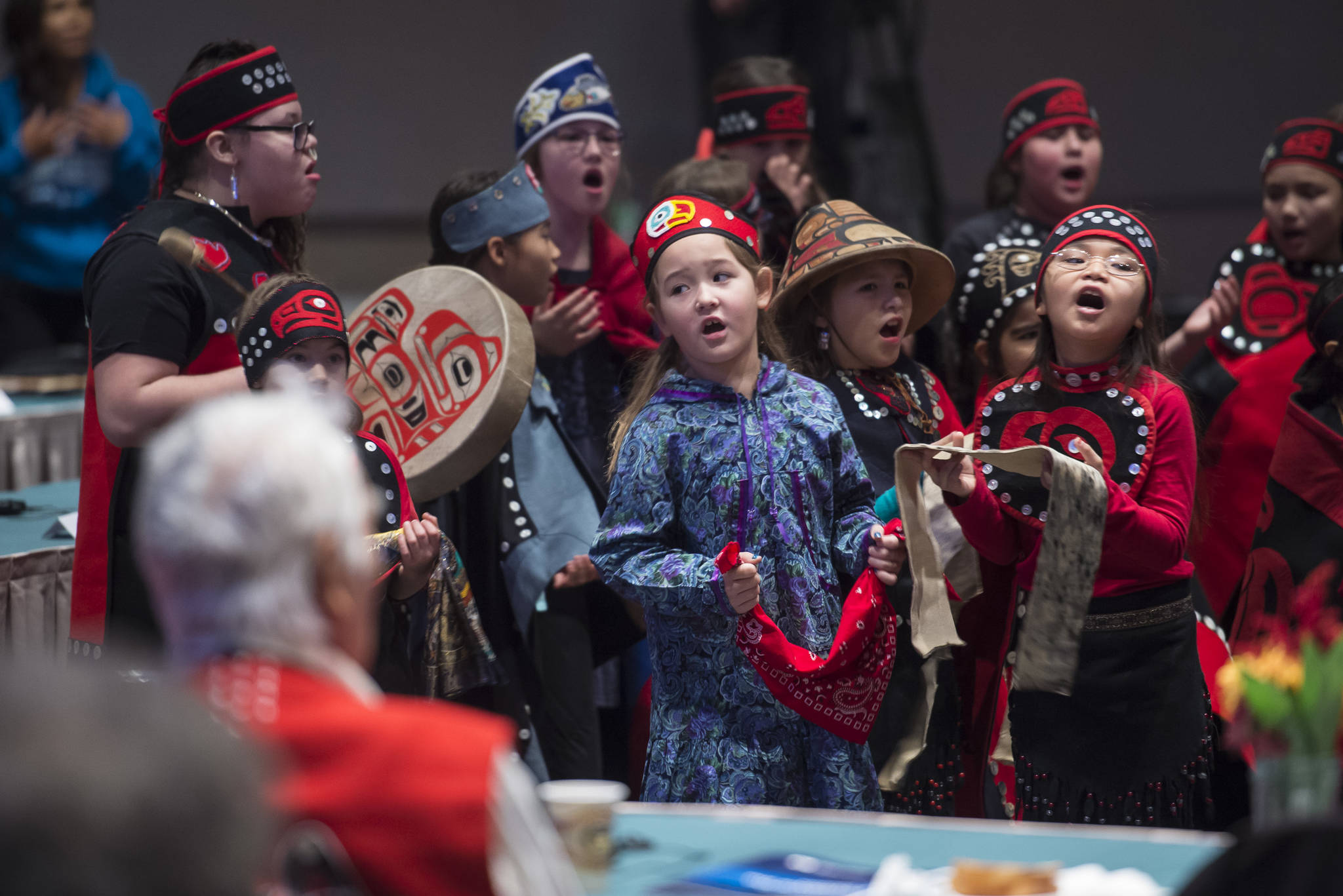 Members of the Tlingit Culture Language and Literacy Dance Group from Harborview Elementary School dance during the Voices of Our Ancestors Language Summit at Centennial Hall on Tuesday, Nov. 13, 2018. (Michael Penn | Juneau Empire)