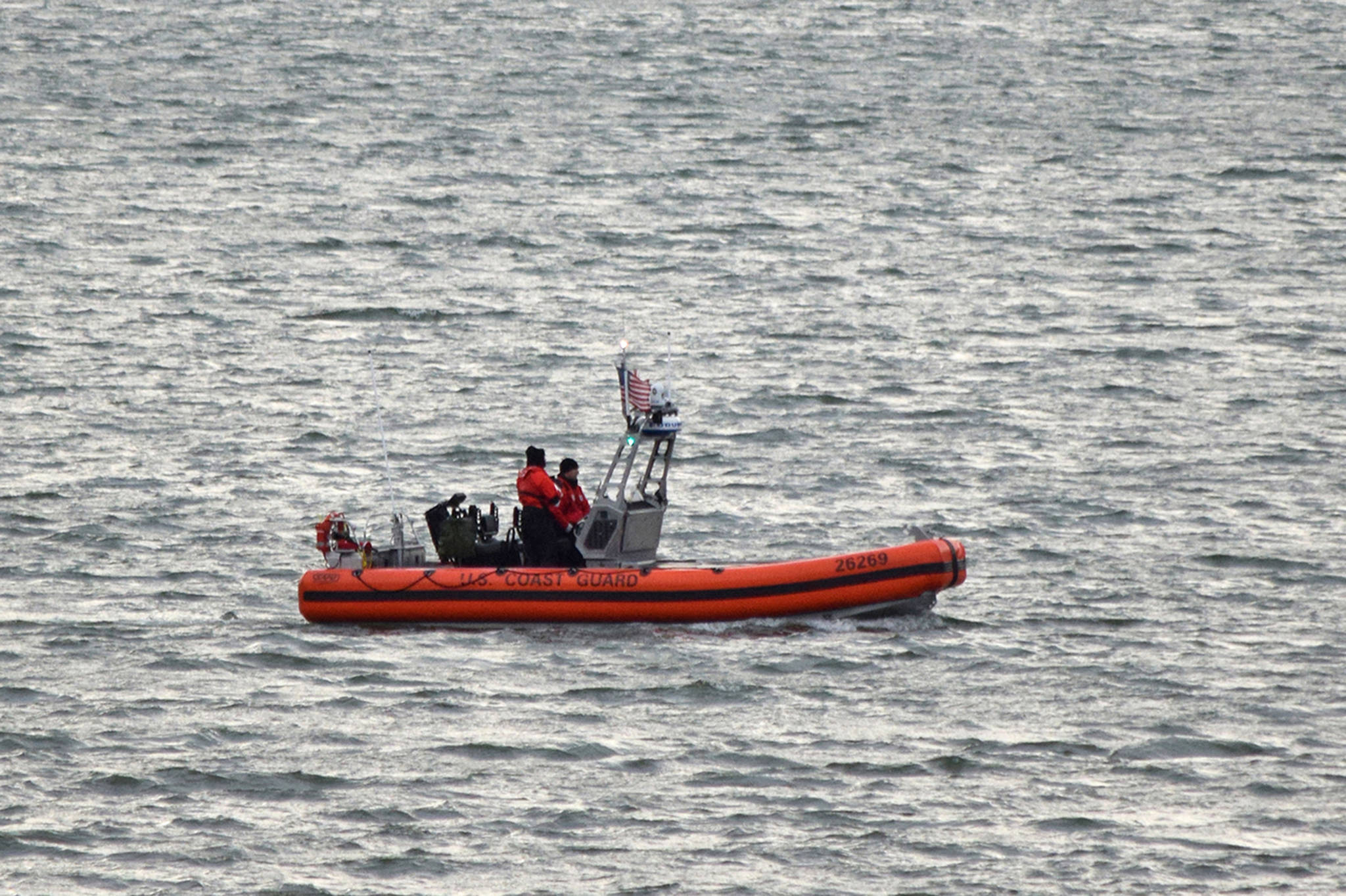 A Coast Guard boat searches Gastineau Channel for two missing boaters on Wednesday, Dec. 6, 2017. (Angelo Saggiomo | Juneau Empire)