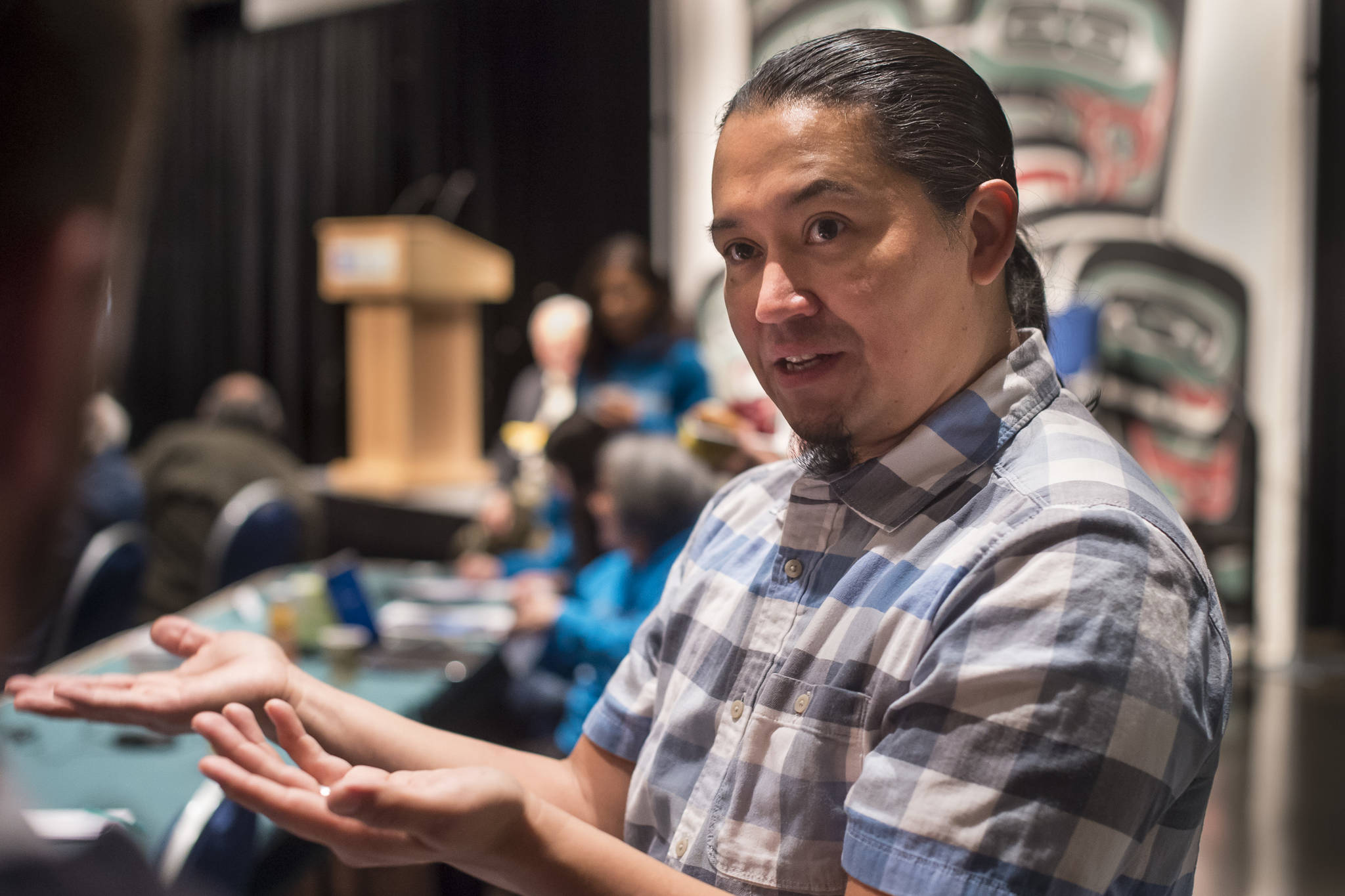 X̱ ’unei Lance Twitchell, Associate Professor of Alaska Native Languages Arts and Sciences at the University of Alaska Southeast, speaks about how new words are created in Native languages at the Voices of Our Ancestors Language Summit at Centennial Hall on Wednesday, Nov. 14, 2018. (Michael Penn | Juneau Empire)