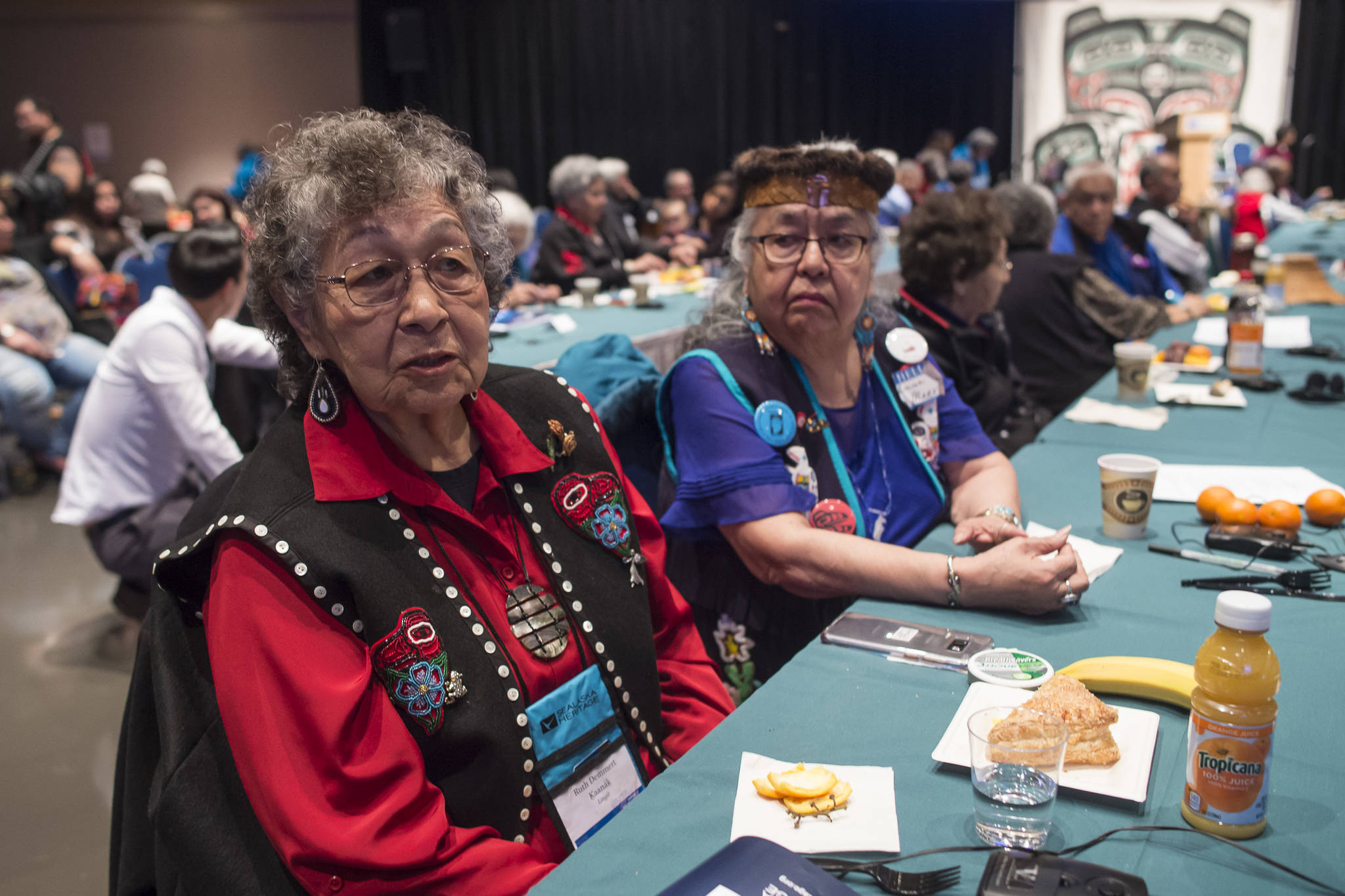 Ruth Demmert, left, and Florence Sheakley talk about how new words are created in Native languages at the Voices of Our Ancestors Language Summit at Centennial Hall on Wednesday, Nov. 14, 2018. (Michael Penn | Juneau Empire)