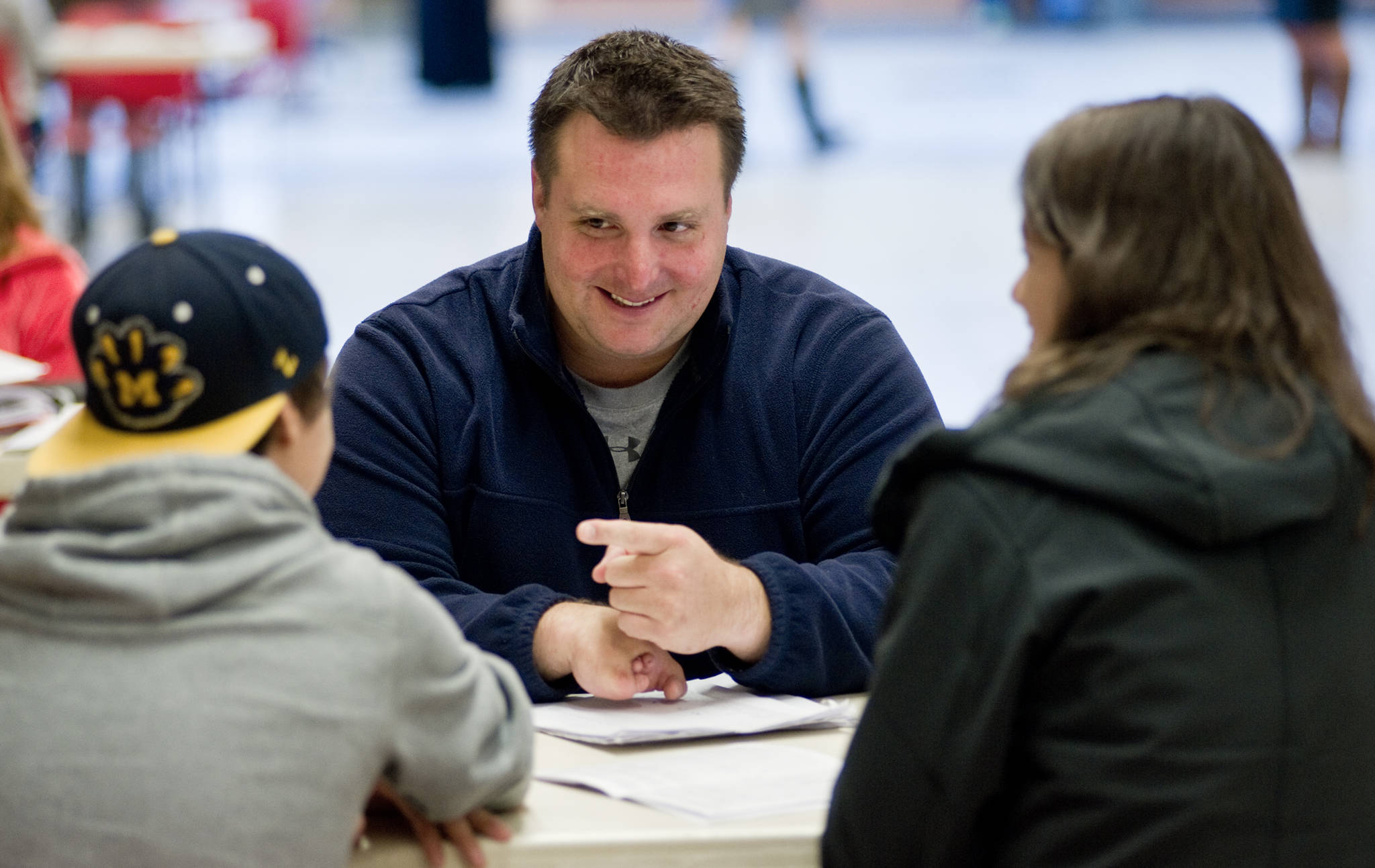 Chad Bentz, a physical education teacher at Juneau-Douglas High School holds a parent/teacher conference at JDHS in 2014. Bentz is on the ballot for the Alaska Sports Hall of Fame Class of 2019. (Michael Penn | Juneau Empire)