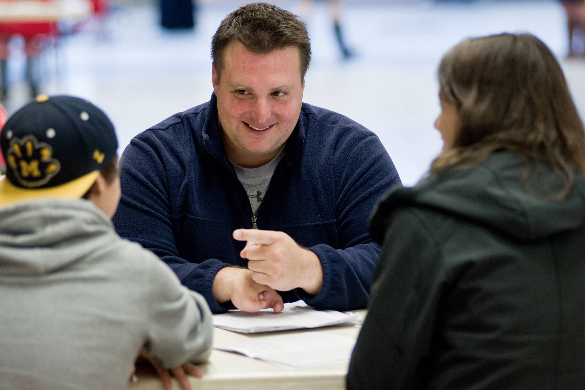 Chad Bentz, a physical education teacher at Juneau-Douglas High School holds a parent/teacher conference at JDHS in 2014. Bentz is on the ballot for the Alaska Sports Hall of Fame Class of 2019. (Michael Penn | Juneau Empire)