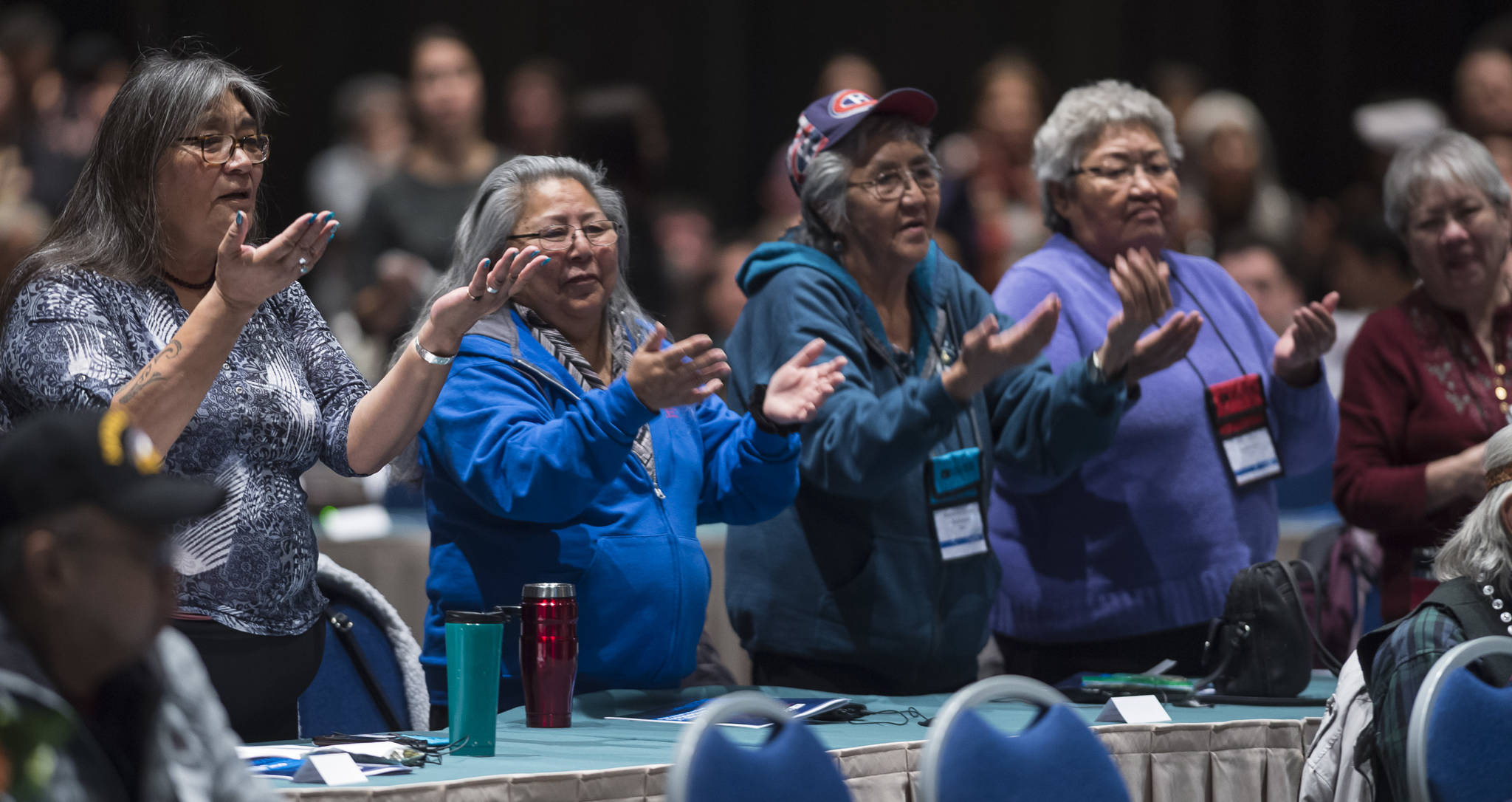 Women dance with the Tlingit Culture Language and Literacy Dance Group from Harborview Elementary School during the Voices of Our Ancestors Language Summit at Centennial Hall on Tuesday, Nov. 13, 2018. (Michael Penn | Juneau Empire)