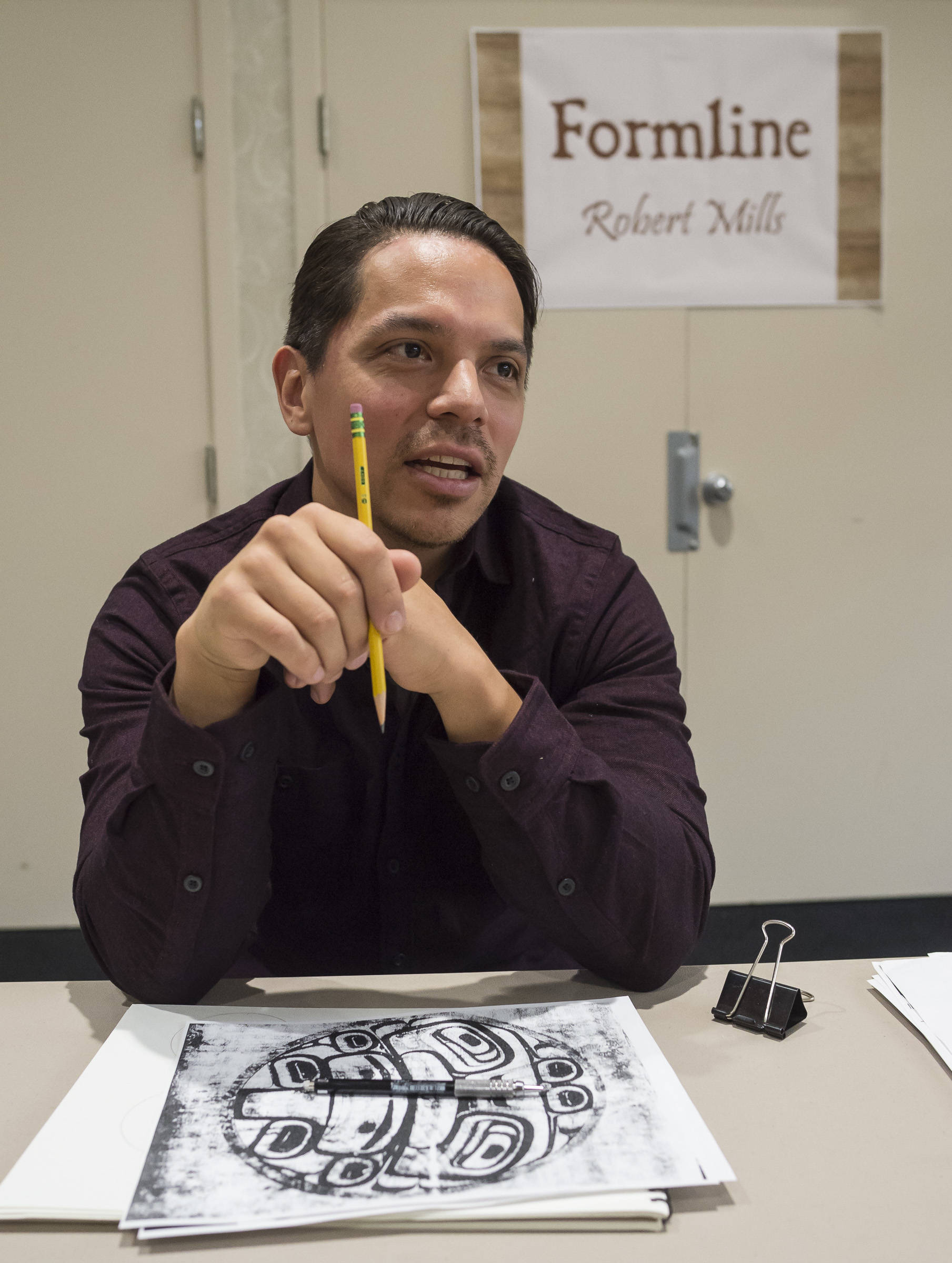 Robert Mills talks about what formline means to him at the Celebrating Our Ways of Life for Native American Heritage Month at the Elizabeth Peratrovich Hall on Friday, Nov. 16, 2018. (Michael Penn | Juneau Empire)
