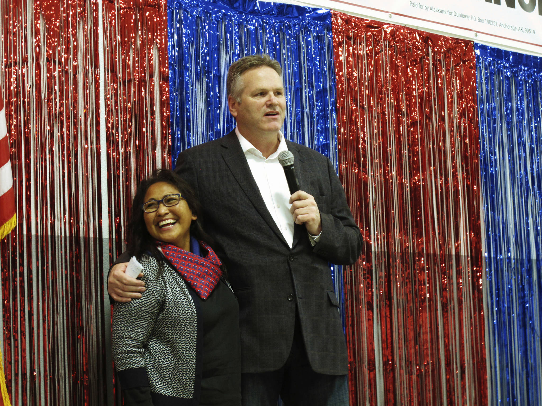 In this Nov. 4 photo, Alaska Republican gubernatorial candidate Mike Dunleavy stands with his wife, Rose, on stage during a GOP rally in Anchorage. For the first time ever, a U.S. governor will be sworn into office above the Arctic Circle. Dunleavy will become Alaska’s top elected official Dec. 3, when he takes the oath of office in Noorvik, a tiny Inupiat Eskimo village above the Arctic Circle and more than a thousand miles from the state capital of Juneau. (Becky Bohrer | Associated Press)