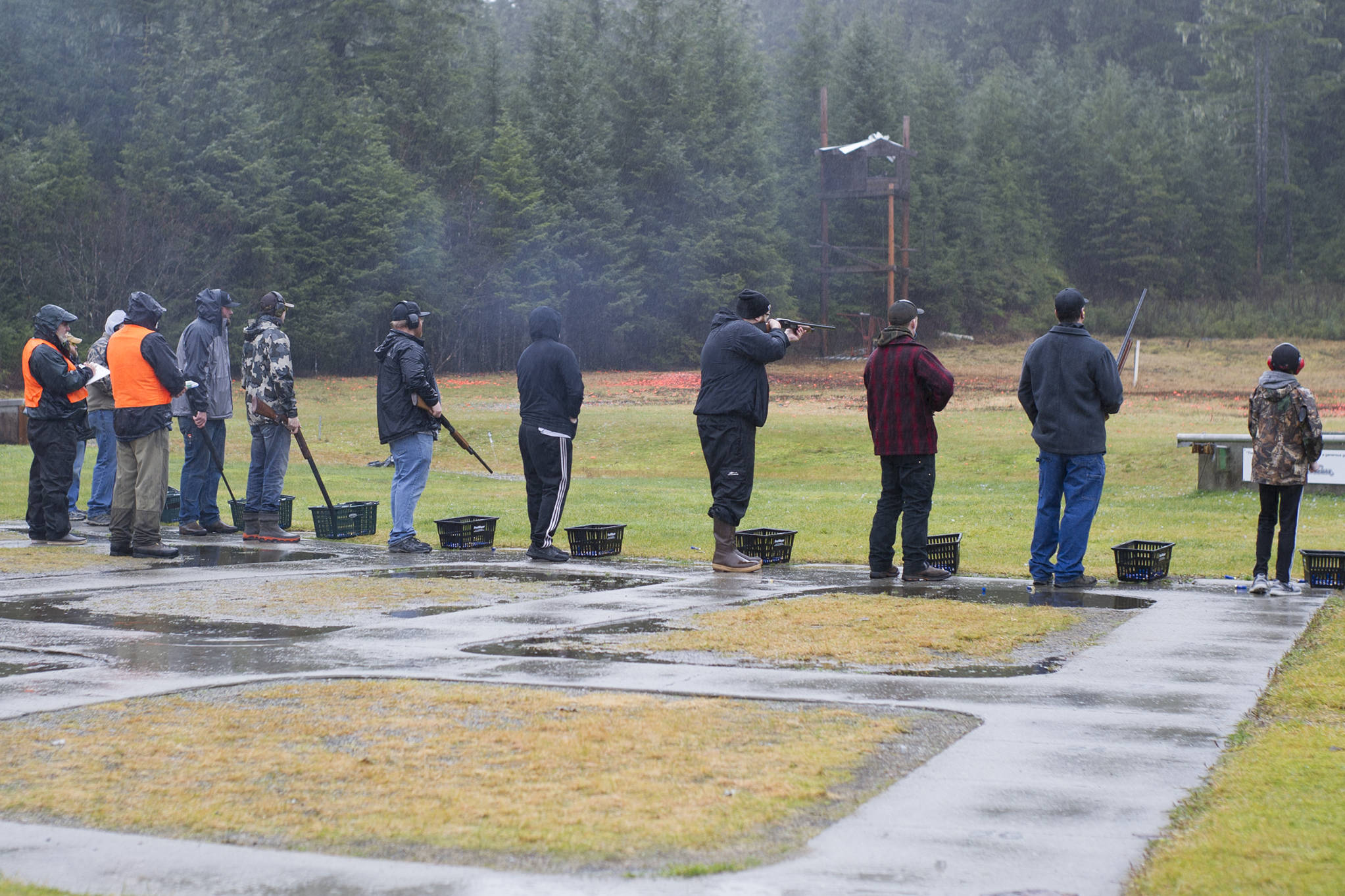 Adults and children participate in a shotgun shooting event for the Thanksgiving Turkey Shoot at the Juneau Gun Club on Saturday. The event was put on by the Juneau Gun Club, Juneau Shooting Sports Foundation, Juneau Archery Club and ADFG, and awarded 90 turkeys. (Nolin Ainsworth | Juneau Empire)