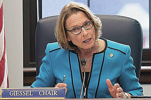 In this file photo, Sen. Cathy Giessel, R-Anchorage, reads one of the two versions of HB 111 dealing with oil tax credits during a Conference Committee hearing at the Capitol on Wednesday, July 12, 2017. (Michael Penn | Juneau Empire File)                                 In this file photo, Sen. Cathy Giessel, R-Anchorage, reads one of the two versions of HB 111 dealing with oil tax credits during a Conference Committee hearing at the Capitol on Wednesday, July 12, 2017. (Michael Penn | Juneau Empire File)