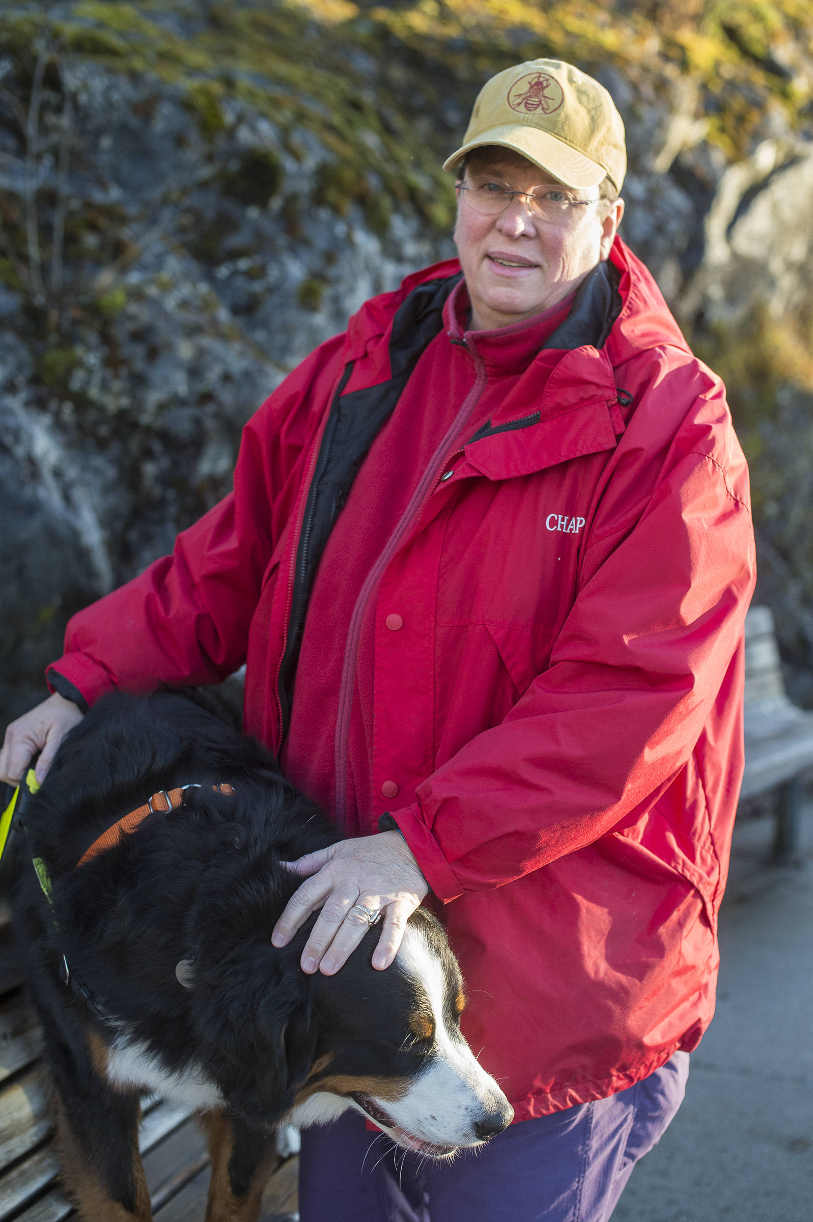 The Rev. Karen Dammann, of Aldersgate United Methodist Church, stops for a picture during a walk with her dog, Pepper, at the Mendenhall Glacier Visitor Center on Wednesday, Nov. 21, 2018. Dammann, who is an openly gay pastor, invites the community to the longtime, inclusive Thanksgiving celebration at Eagle River United Methodist Camp. (Michael Penn | Juneau Empire)
