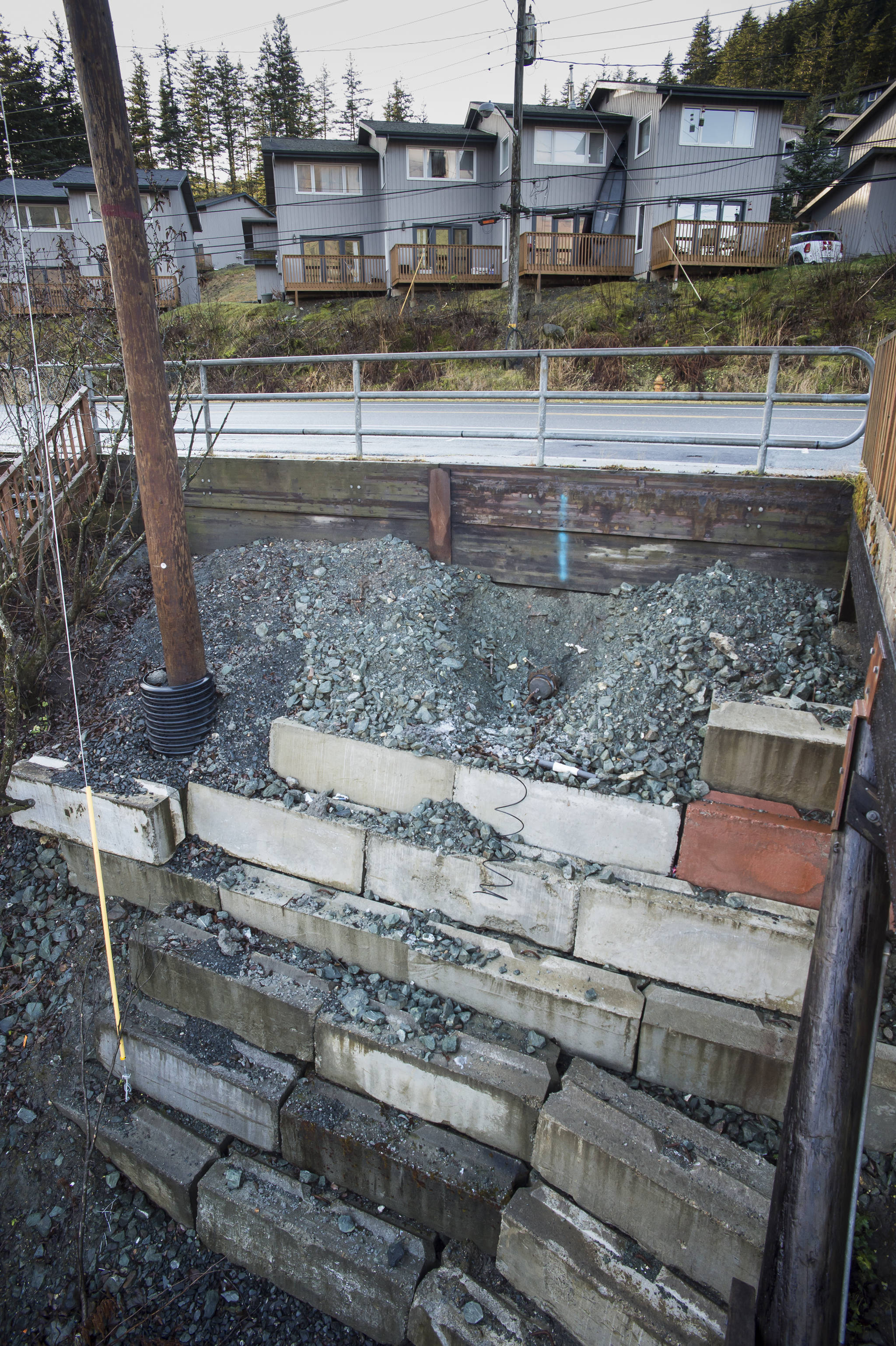 Cement blocks hold back an area that eroded last winter in the 2500 block of Douglas Highway on Wednesday, Nov. 21, 2018. (Michael Penn | Juneau Empire)