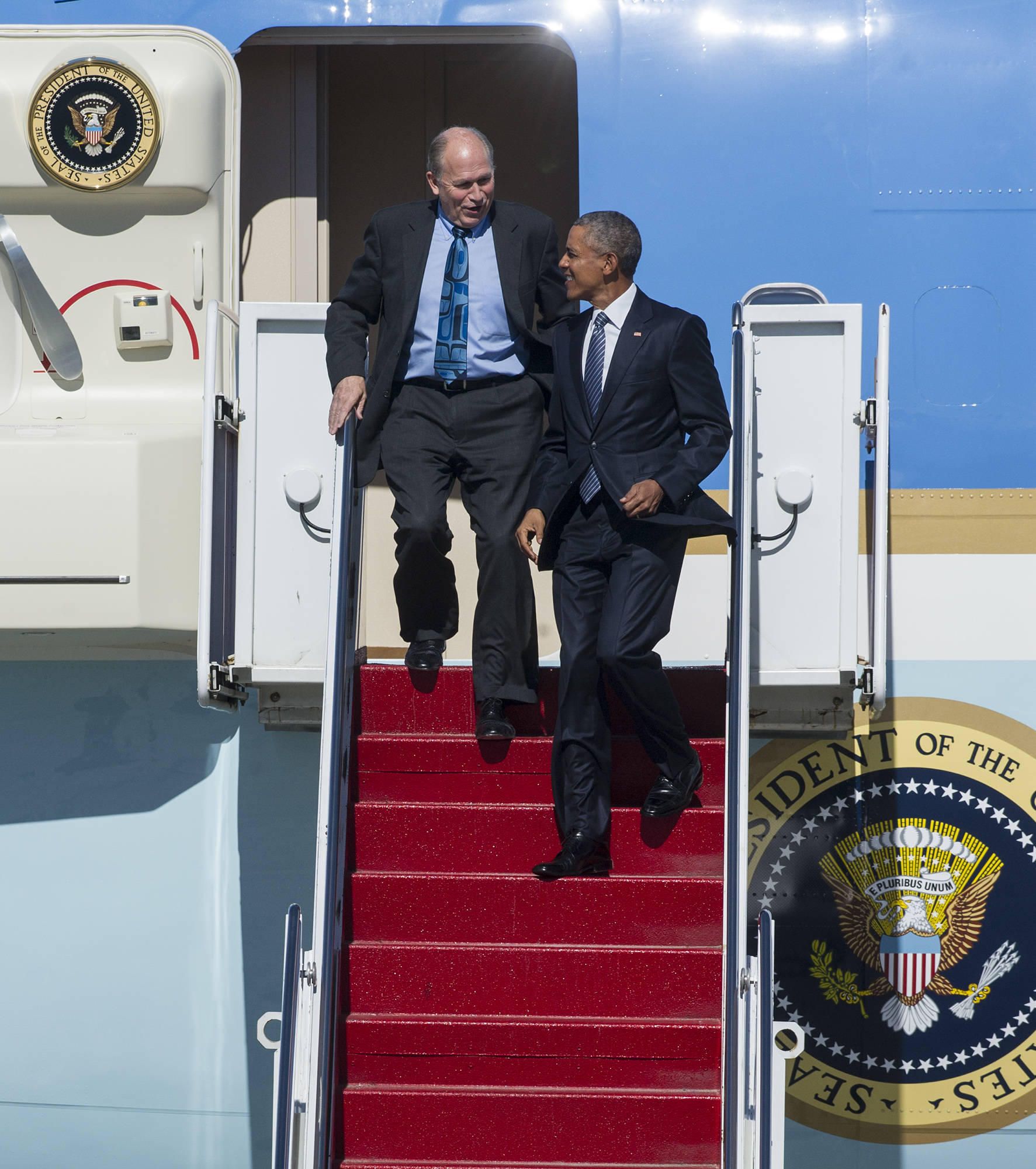 In this Aug. 31, 2015 photo, President Barack Obama arrives on Air Force One at Joint Base Elmendorf-Richardson in Anchorage with Gov. Bill Walker. (Michael Penn | Juneau Empire File)