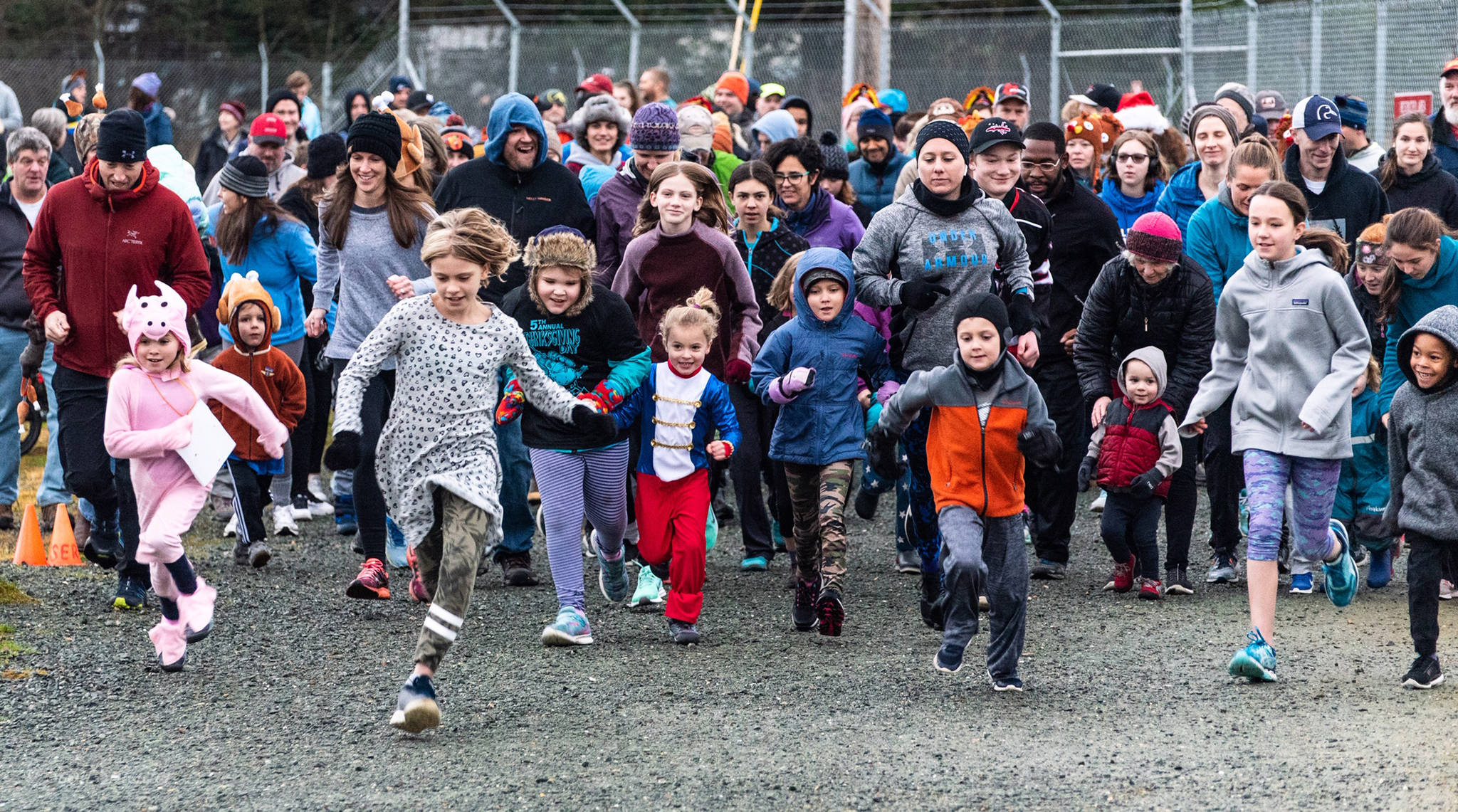 Runners take off from the beginning of the Airport Dike Trail on Thursday for the fifth annual Thanksgiving Day Turkey Trot. Race proceeds went to the Juneau-Douglas High School hockey and Thunder Mountain High School cross country teams. (Courtesy Photo | Scott Spickler)