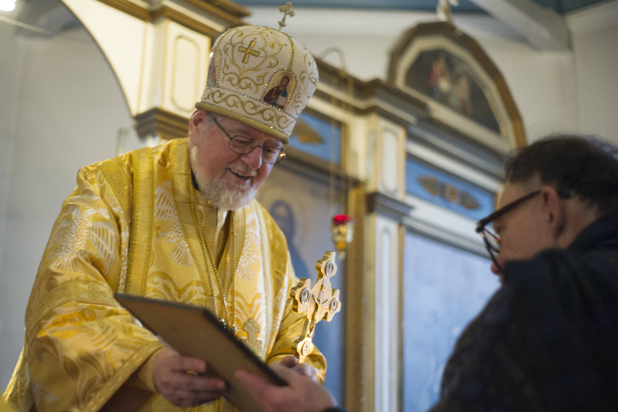 Bishop David, leader of the Russian Orthodox Church’s Diocese of Alaska, presents a certificate of appreciation to Patrick Kearney at the end of Divine Liturgy at St. Nicholas Russian Orthodox Chruch on Sunday, Nov. 25, 2015. (Nolin Ainsworth | Juneau Empire)