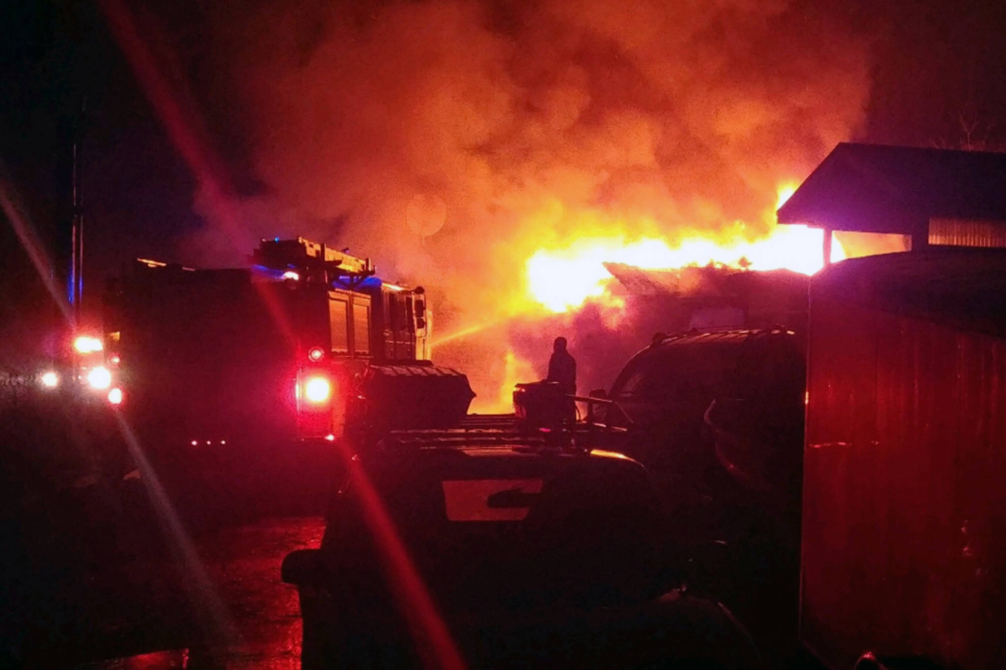Hoonah Volunteer Fire Department firefighters battle a blaze at cabins in Hoonah on Saturday, Nov. 24, 2018. (Courtesy Photo | Hoonah Volunteer Fire Department)
