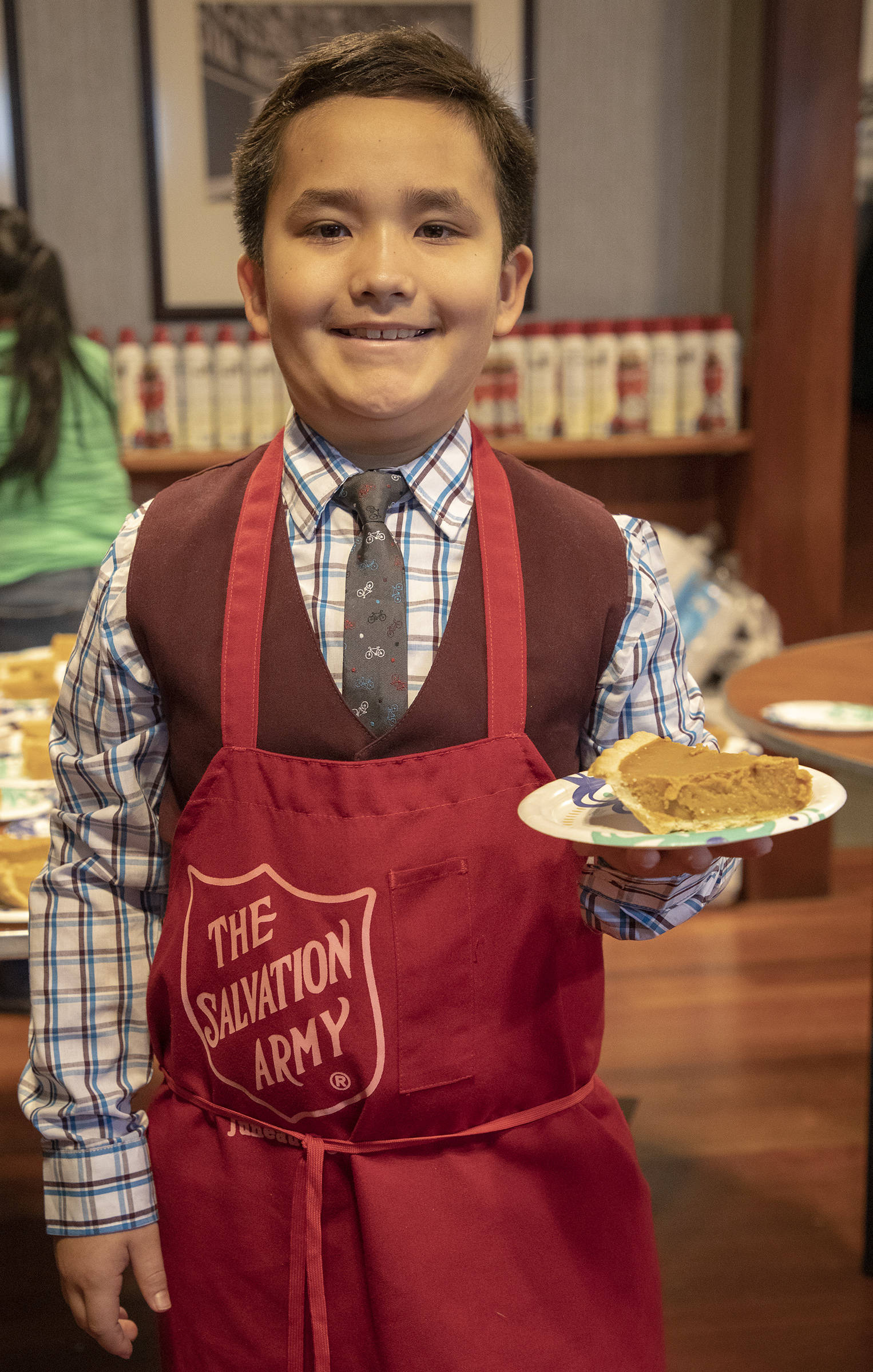 A young volunteer named Austin poses with a slice of pie at the Salvation Army’s annual Thanksgiving dinner. (Courtesy Photo | Salvation Army)