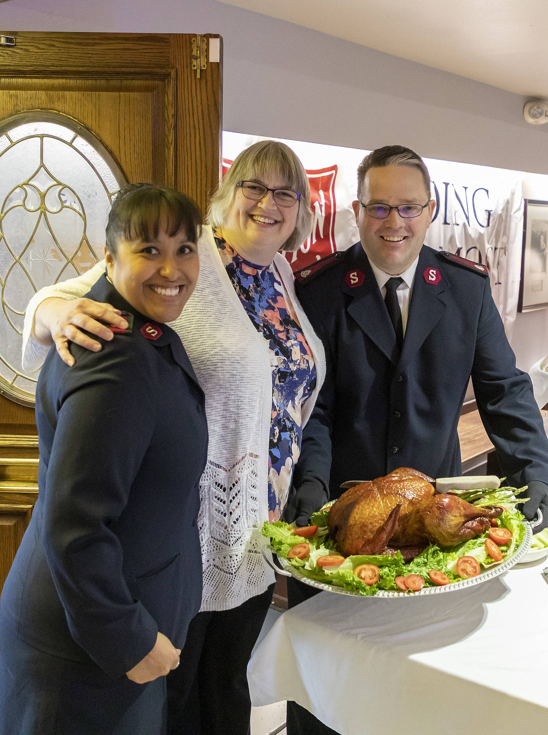 Majors Gina (left) and Shane Halverson of the Salvation Army pose with Mayor Beth Weldon at the annual Salvation Army Thanksgiving dinner on Nov. 22, 2018. (Courtesy Photo | Salvation Army)