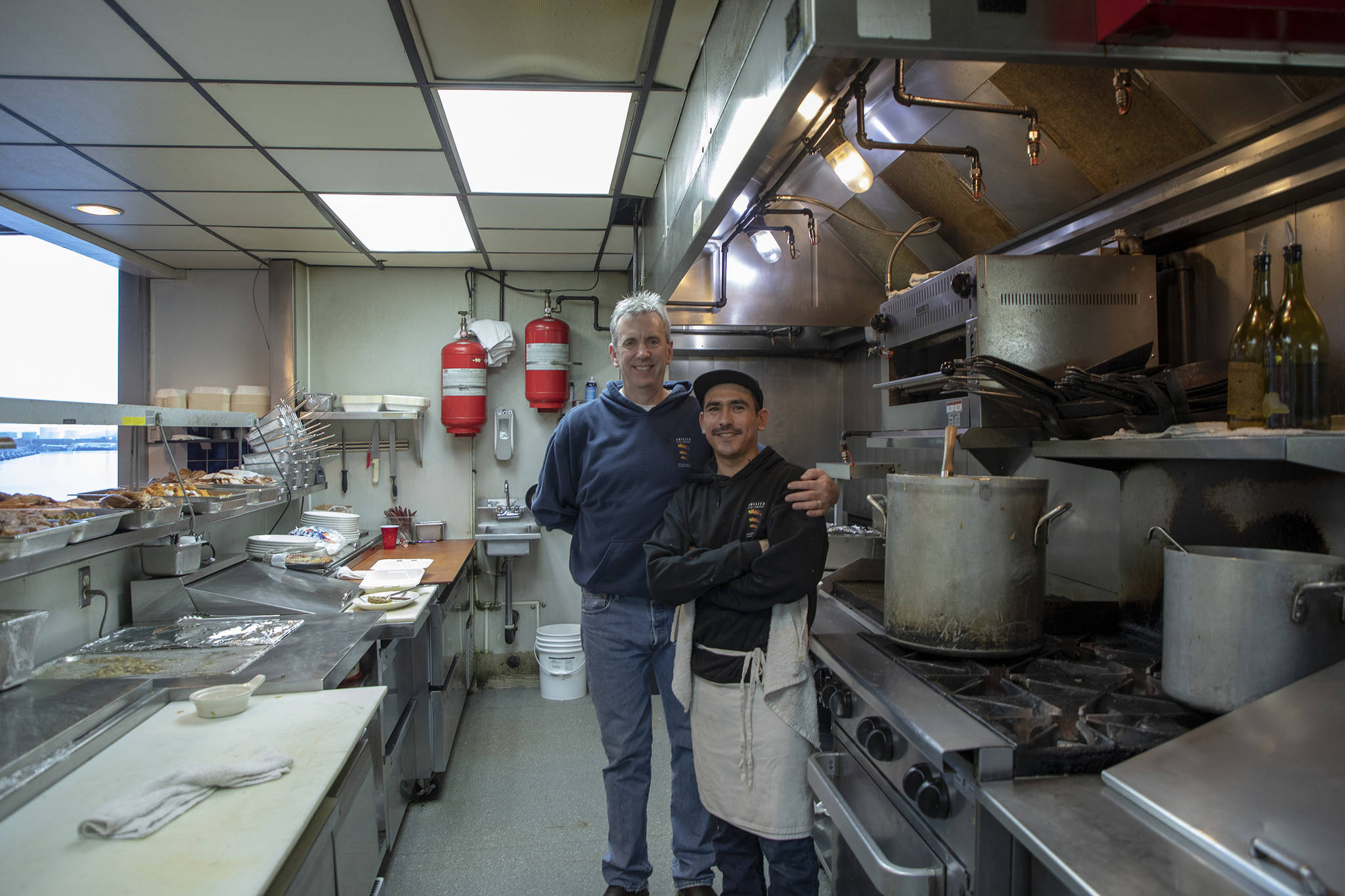 Chefs Ron Burns (left) and Juan-Antonio Salazar Ayon pose at the Salvation Army’s annual Thanksgiving dinner. (Courtesy Photo | Salvation Army)