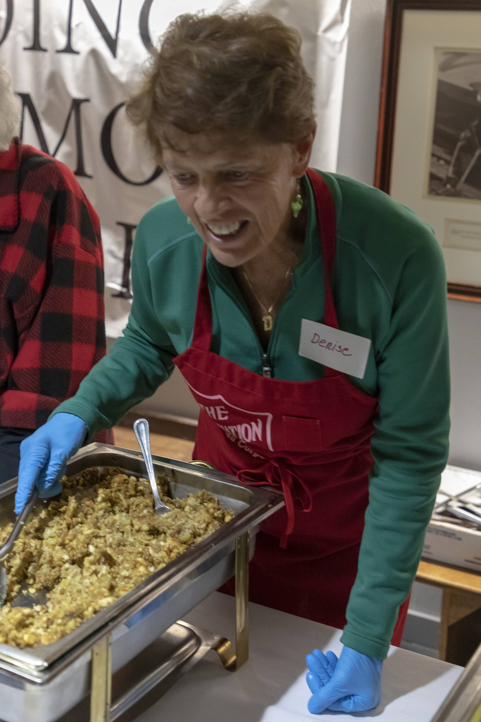 A volunteer serves food at the Salvation Army’s annual Thanksgiving dinner. (Courtesy Photo | Salvation Army)